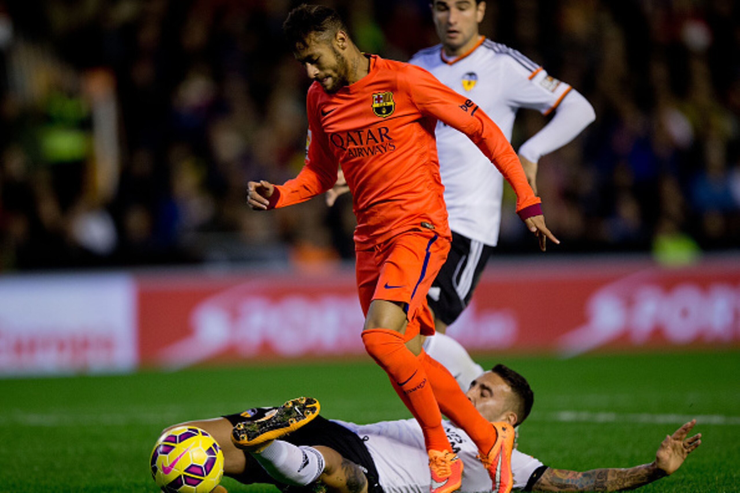 VALENCIA, SPAIN - NOVEMBER 30: Nicolas Otamendi of Valencia CF (L) tackles Neymar JR. (R) of FC Barcelona (R)  during the La Liga match between Valencia CF and FC Barcelona at Estadi de Mestalla on November 30, 2014 in Valencia, Spain.  (Photo by Gonzalo 