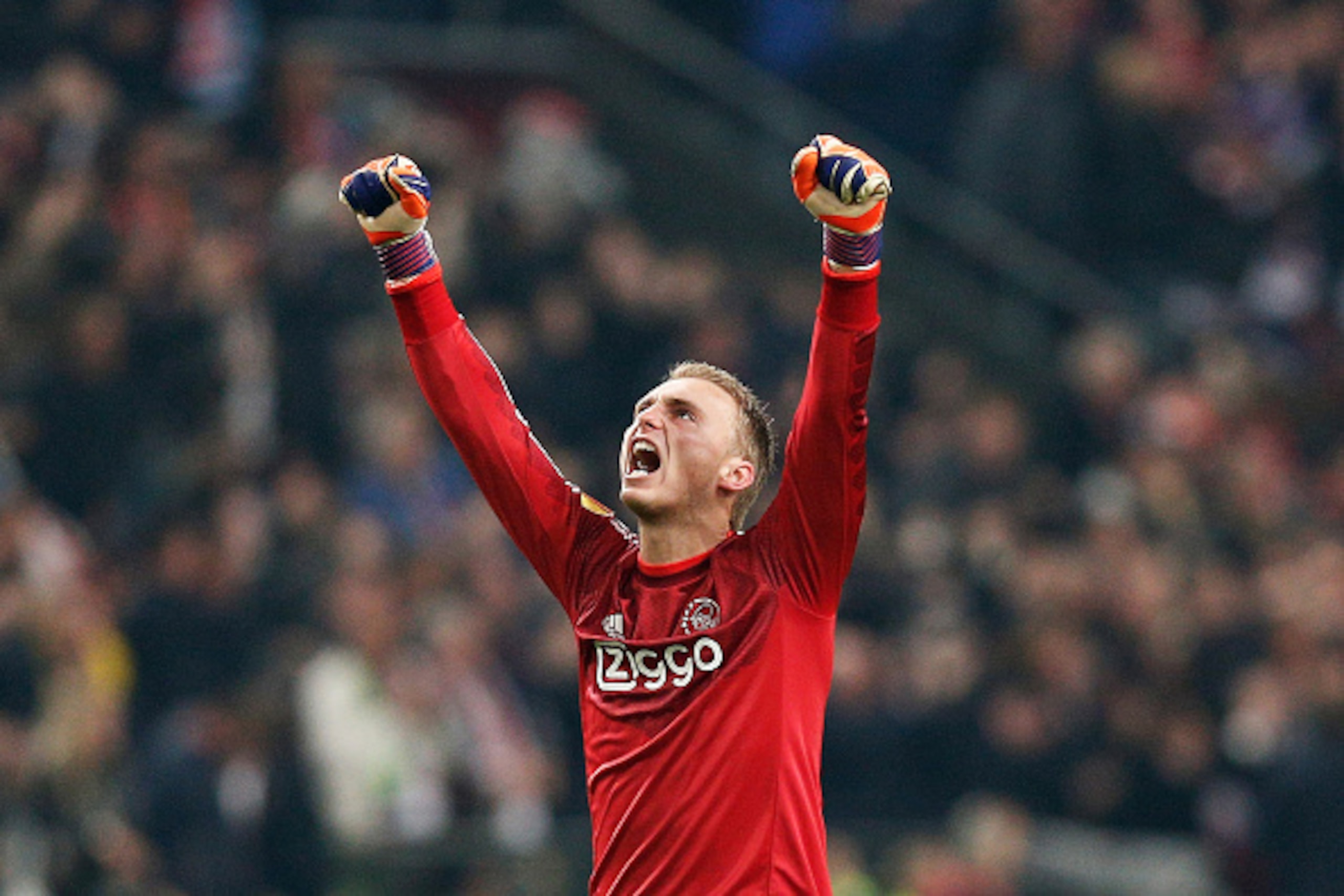 AMSTERDAM, NETHERLANDS - MARCH 19:  Goalkeeper Jasper Cillessen of Ajax celebrates after teammate Riechedly Bazoer of Ajax scores a goal to level the scores at 1-1 on aggregate during the UEFA Europa League Round of 16, second leg match between AFC Ajax v