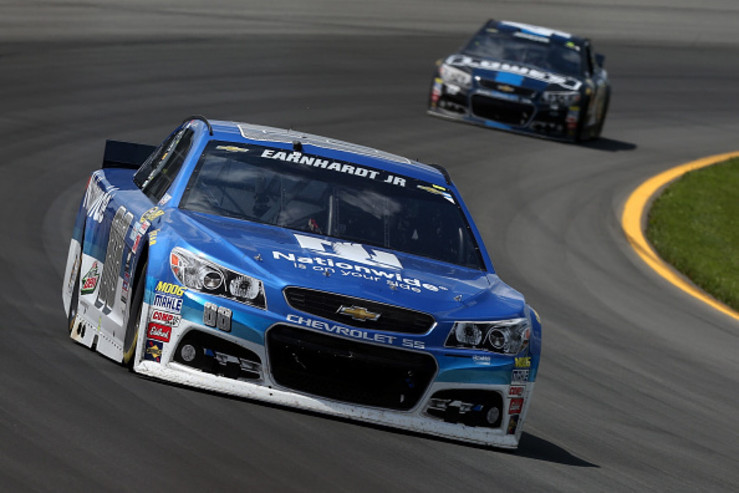 LONG POND, PA - JUNE 07:  Dale Earnhardt Jr., driver of the #88 Nationwide Chevrolet, leads Jimmie Johnson, driver of the #48 Lowe's/Jimmie Johnson Foundation Chevrolet, during the NASCAR Sprint Cup Series Axalta 'We Paint Winners' 400 at Pocono Raceway o