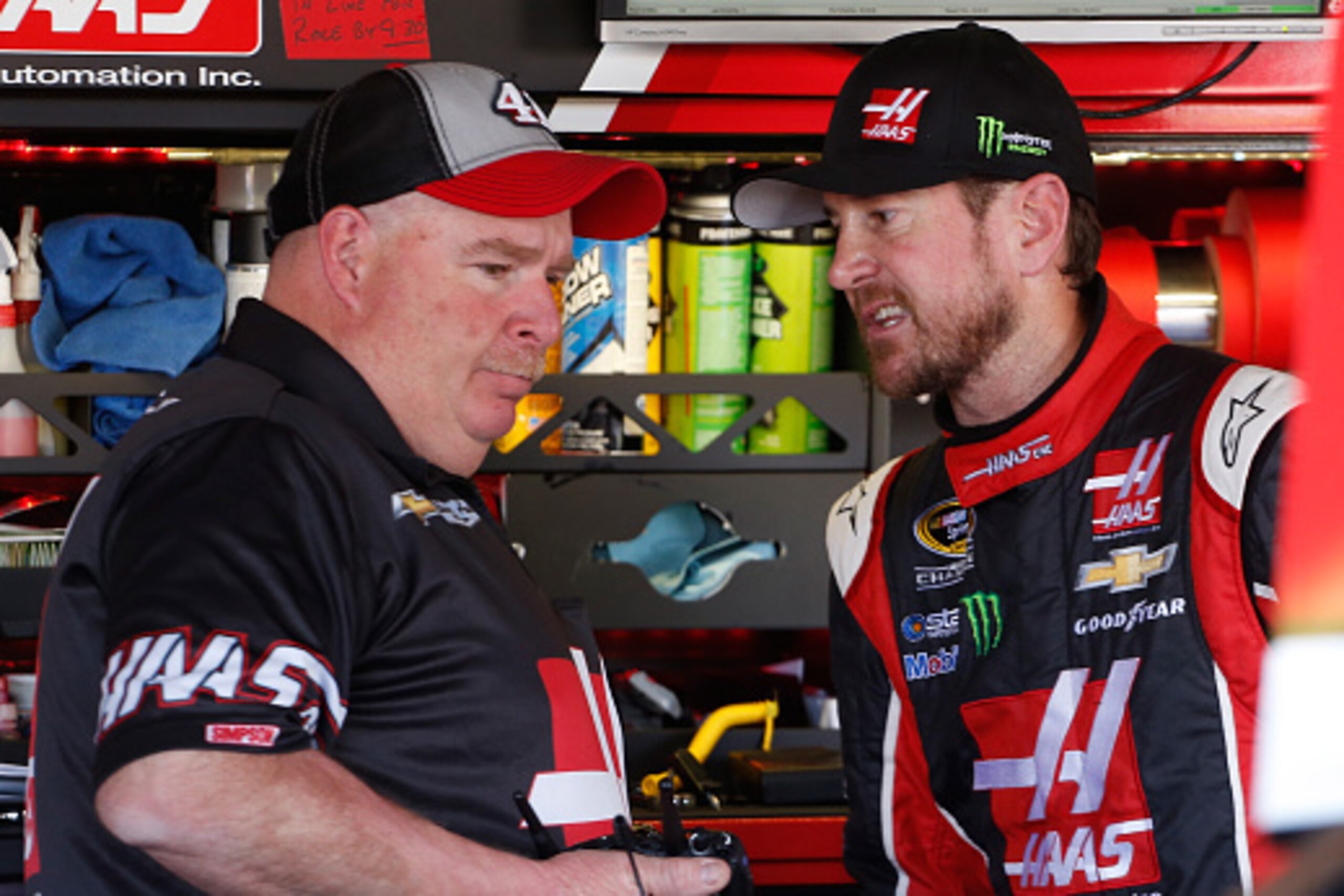 AVONDALE, AZ - MARCH 14: Kurt Busch, driver of the #41 Haas Automation Chevrolet (right) talks to crew chief Tony Gibson in the garage area during practice for the NASCAR Sprint Cup Series CampingWorld.com 500 at Phoenix International Raceway on March 14,