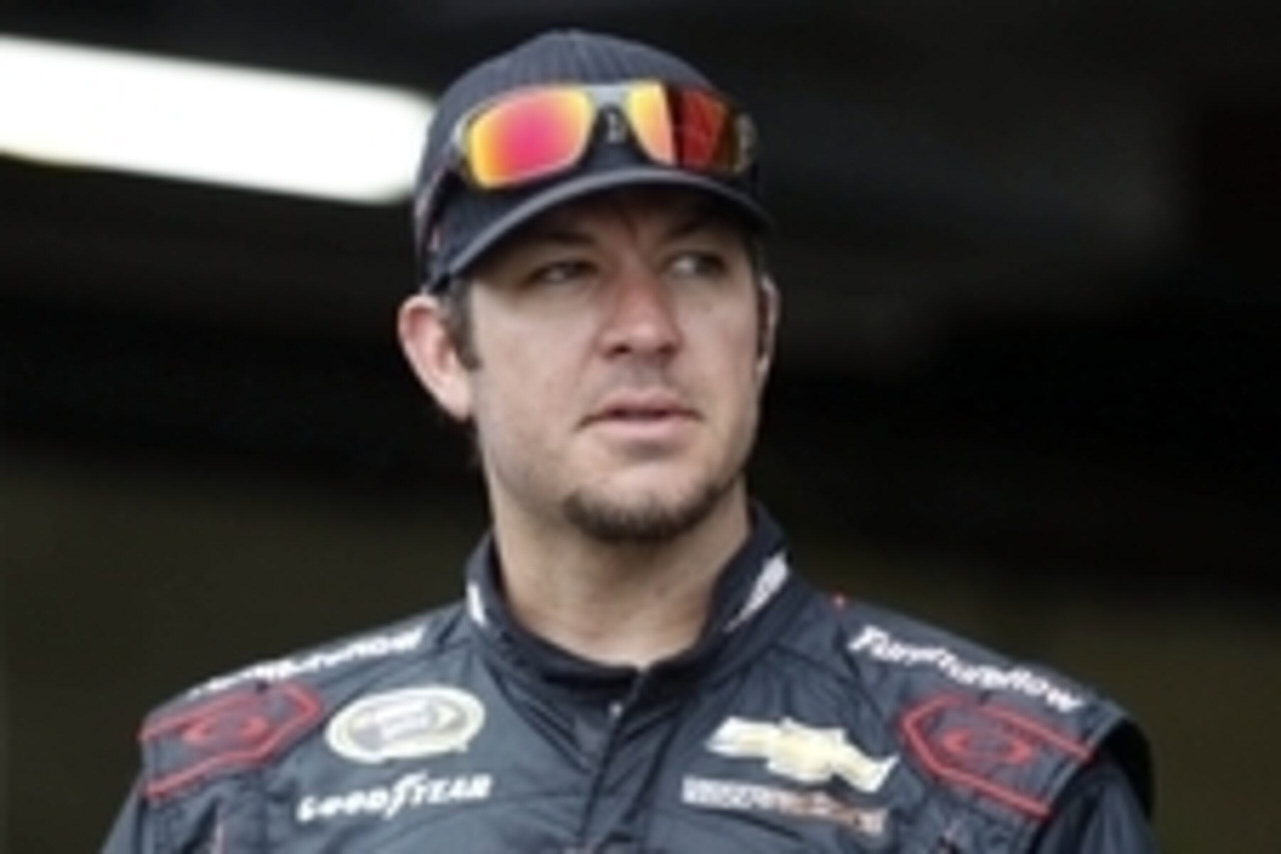 Jun 13, 2015; Brooklyn, MI, USA; Sprint Cup Series driver Martin Truex Jr. (78) looks on from the garage during practice of the Quicken Loans 400. at Michigan International Speedway. Mandatory Credit: Aaron Doster-USA TODAY Sports