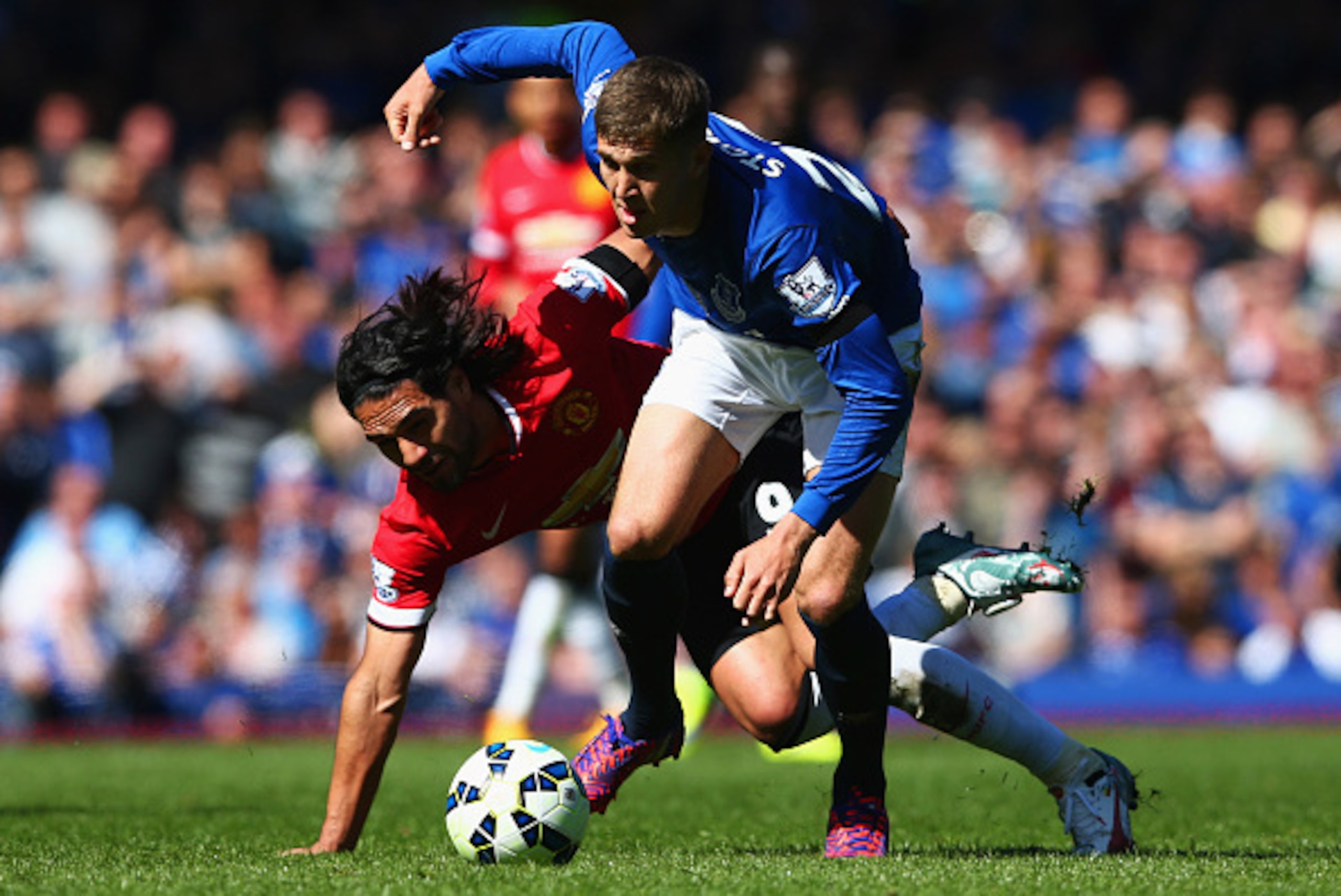 LIVERPOOL, ENGLAND - APRIL 26:  John Stones of Everton battles with Radamel Falcao Garcia of Manchester United during the Barclays Premier League match between Everton and Manchester United at Goodison Park on April 26, 2015 in Liverpool, England.  (Photo