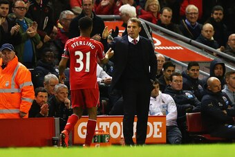LIVERPOOL, ENGLAND - APRIL 13:  Brendan Rodgers manager of Liverpool shakes hands with Raheem Sterling of Liverpool as he is substituted during the Barclays Premier League match between Liverpool and Newcastle United at Anfield on April 13, 2015 in Liverp