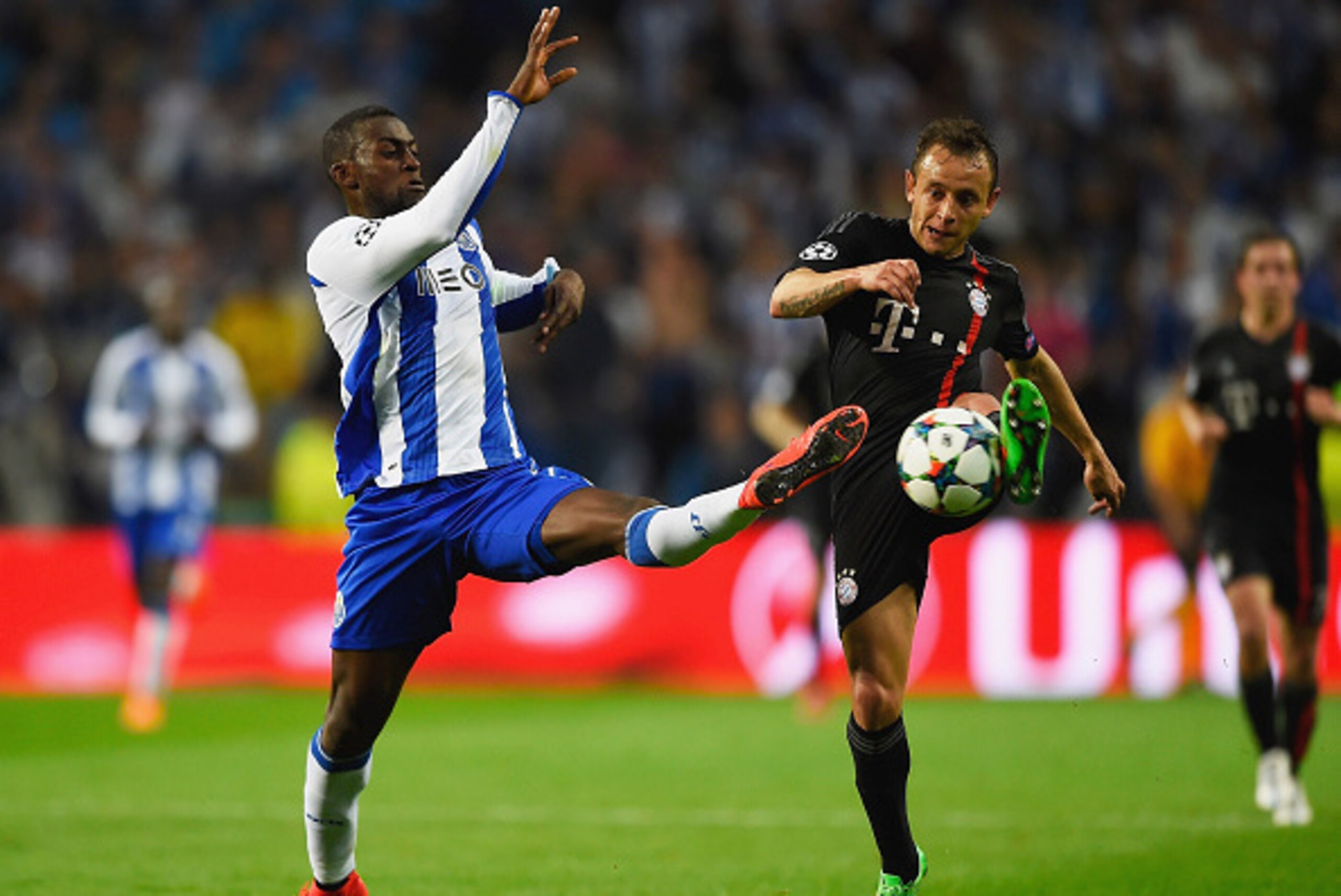 PORTO, PORTUGAL - APRIL 15:  Jackson Martinez of FC Porto challenges Rafinha of Bayern Muenchen during the UEFA Champions League Quarter Final first leg match between FC Porto and FC Bayern Muenchen at Estadio do Dragao on April 15, 2015 in Porto, Portuga