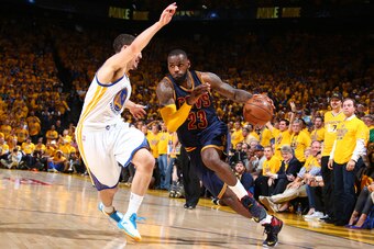 OAKLAND, CA - JUNE 14: LeBron James #23 of the Cleveland Cavaliers drives against Klay Thompson #11 of the Golden State Warriors during Game Five of the 2015 NBA Finals on June 14, 2015 at Oracle Arena in Oakland, California. NOTE TO USER: User expressly