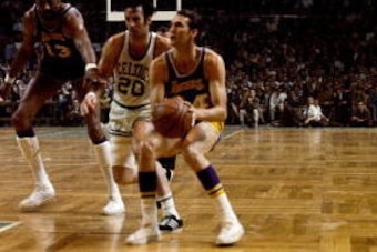 BOSTON - 1969:  Jerry West #44 of the Los Angeles Lakers looks to shoot against Larry Siegfried #20 of the Boston Celtics during a game played circa 1969 at the Boston Garden in Boston, Massachusetts. NOTE TO USER: User expressly acknowledges that, by dow