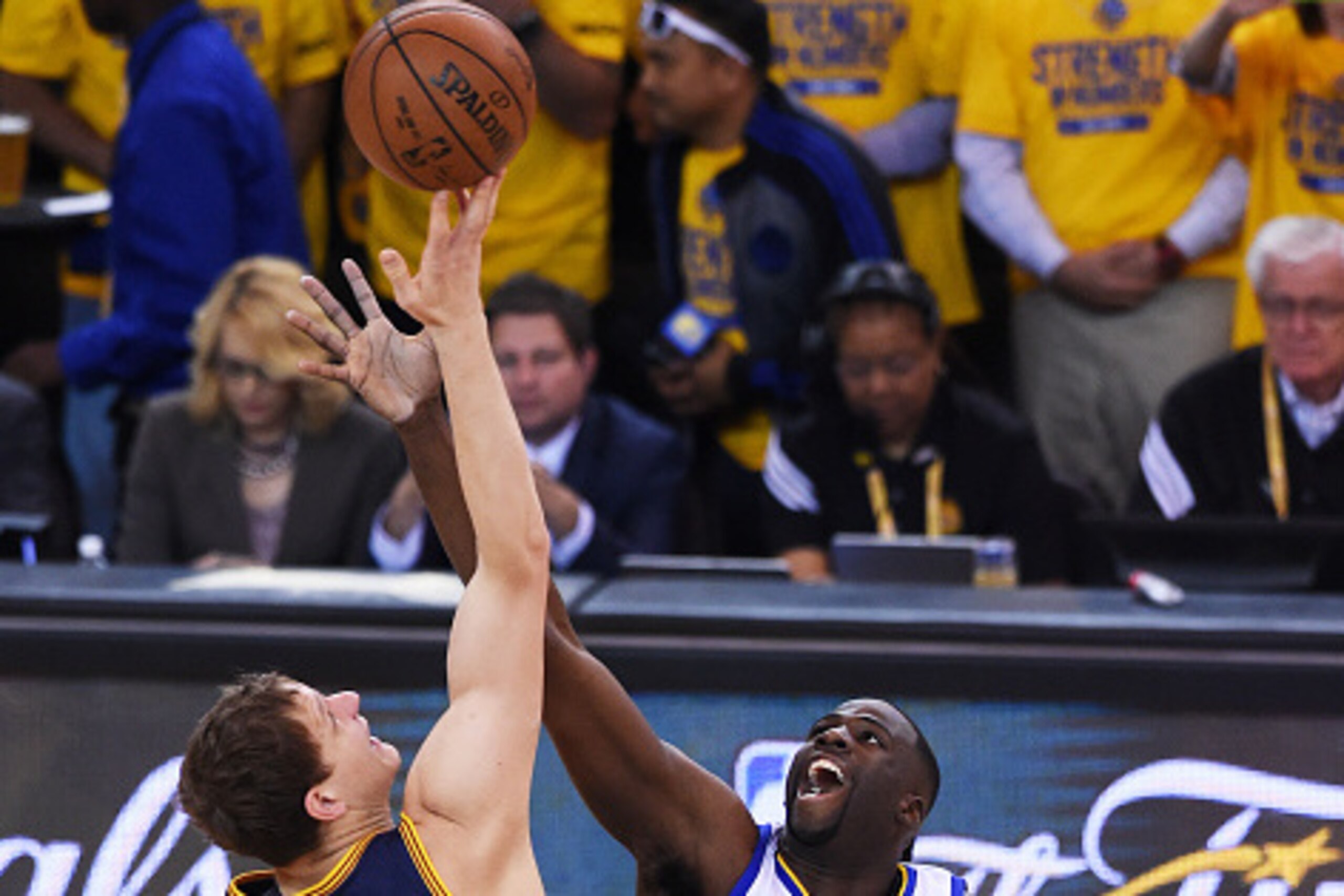 OAKLAND, CA - JUNE 14:  The opening tipoff between Timofey Mozgov #20 of the Cleveland Cavaliers and Draymond Green #23 of the Golden State Warriors during Game Five of the 2015 NBA Finals at ORACLE Arena on June 14, 2015 in Oakland, California. NOTE TO U