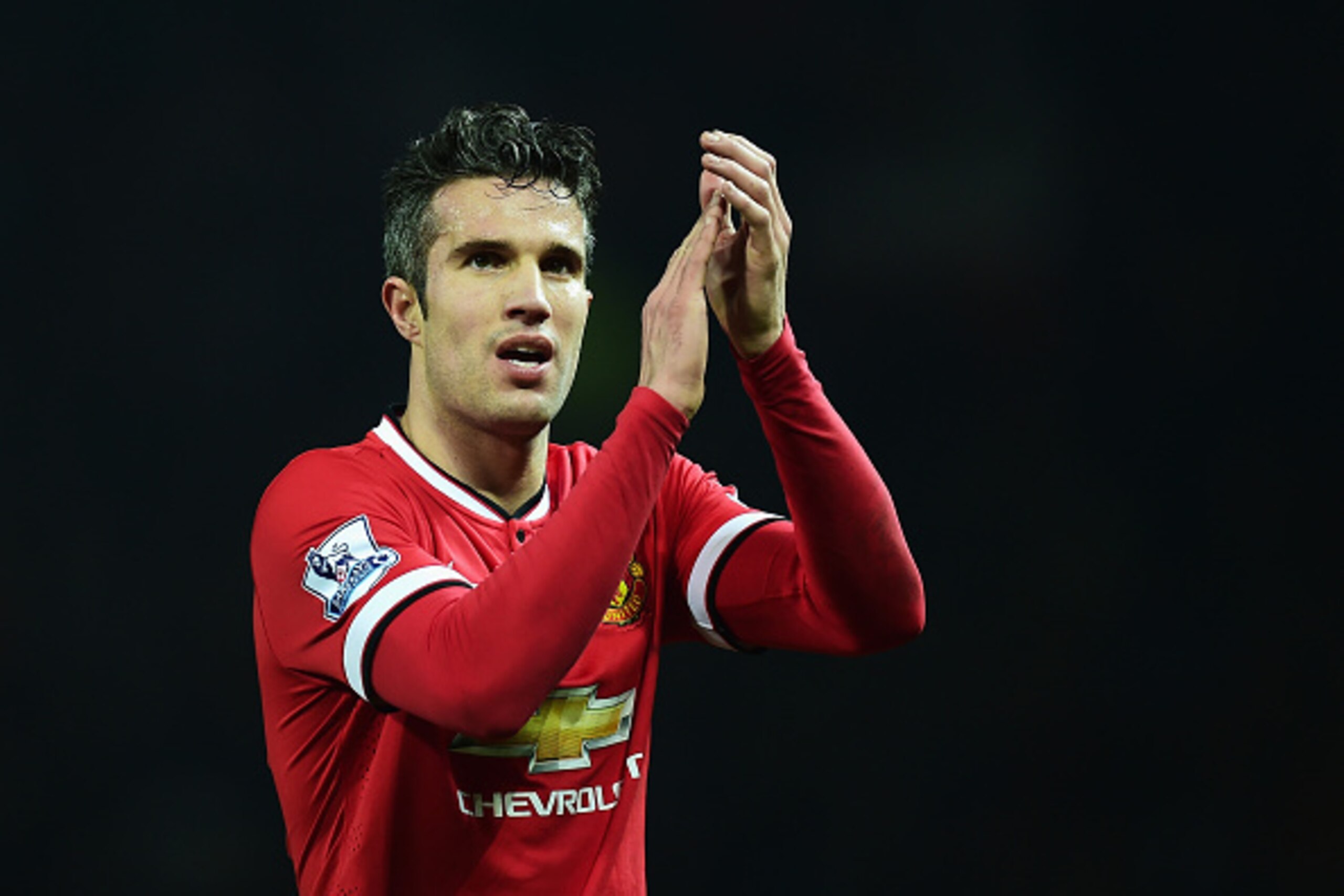 MANCHESTER, ENGLAND - FEBRUARY 11: Robin van Persie of Manchester United celebrates victory after the Barclays Premier League match between Manchester United and Burnley at Old Trafford on February 11, 2015 in Manchester, England.  (Photo by Jamie McDonal