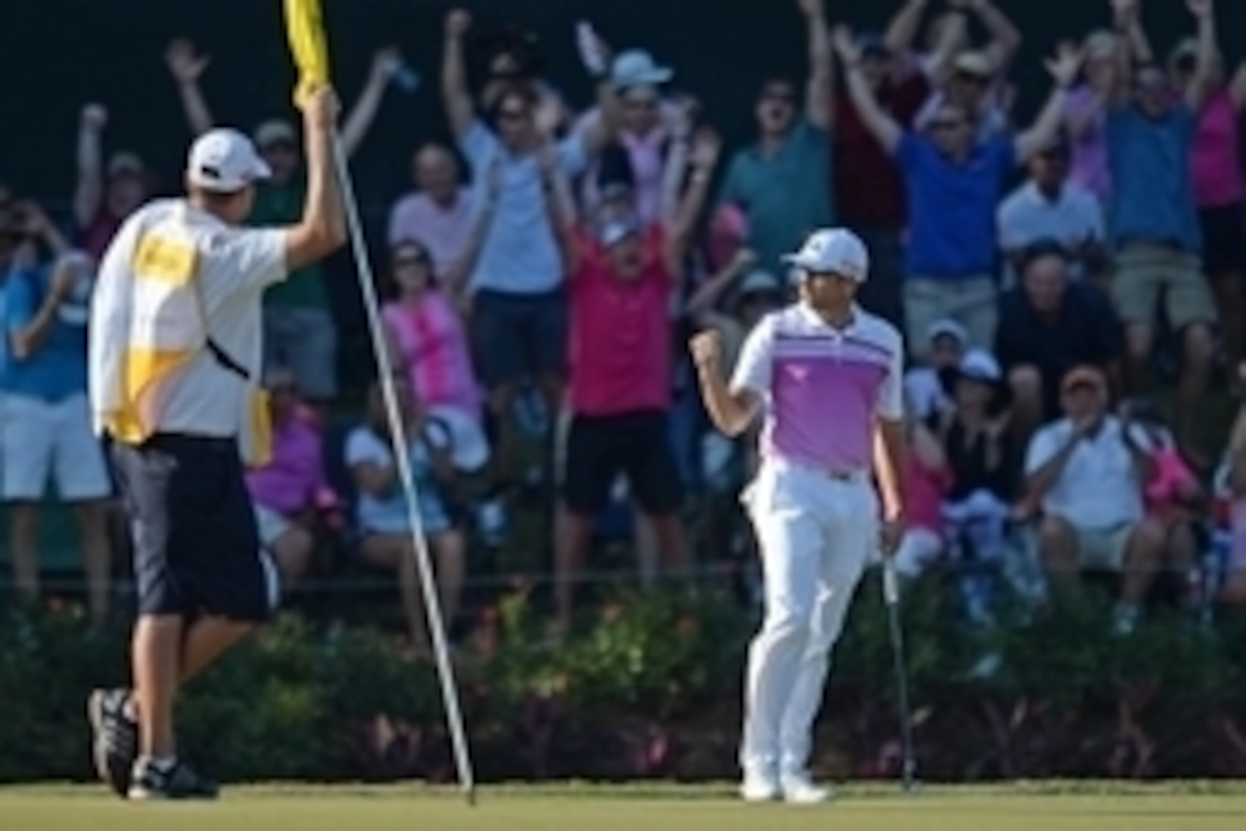 May 10, 2015; Ponte Vedra Beach, FL, USA; Sergio Garcia (right) pumps his fist after making a birdie putt on the 17th green during the final round at TPC Sawgrass - Stadium Course. Mandatory Credit: Jake Roth-USA TODAY Sports