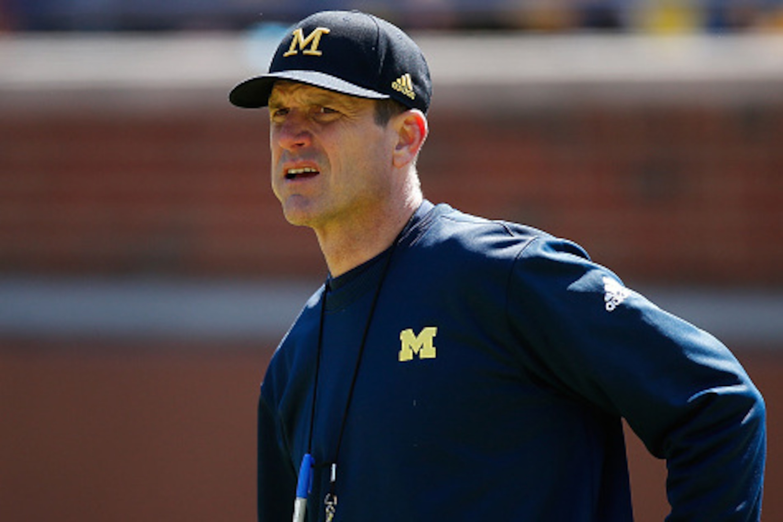 ANN ARBOR, MI - APRIL 04: Head coach Jim Harbaugh of the Michigan Wolverines looks on during the Michigan Football Spring Game on April 4, 2015 at Michigan Stadium in Ann Arbor, Michigan. (Photo by Gregory Shamus/Getty Images) ANN ARBOR, MI - APRIL 04: Head coach Jim Harbaugh of the Michigan Wolverines looks on during the Michigan Football Spring Game on April 4, 2015 at Michigan Stadium in Ann Arbor, Michigan. (Photo by Gregory Shamus/Getty Images)