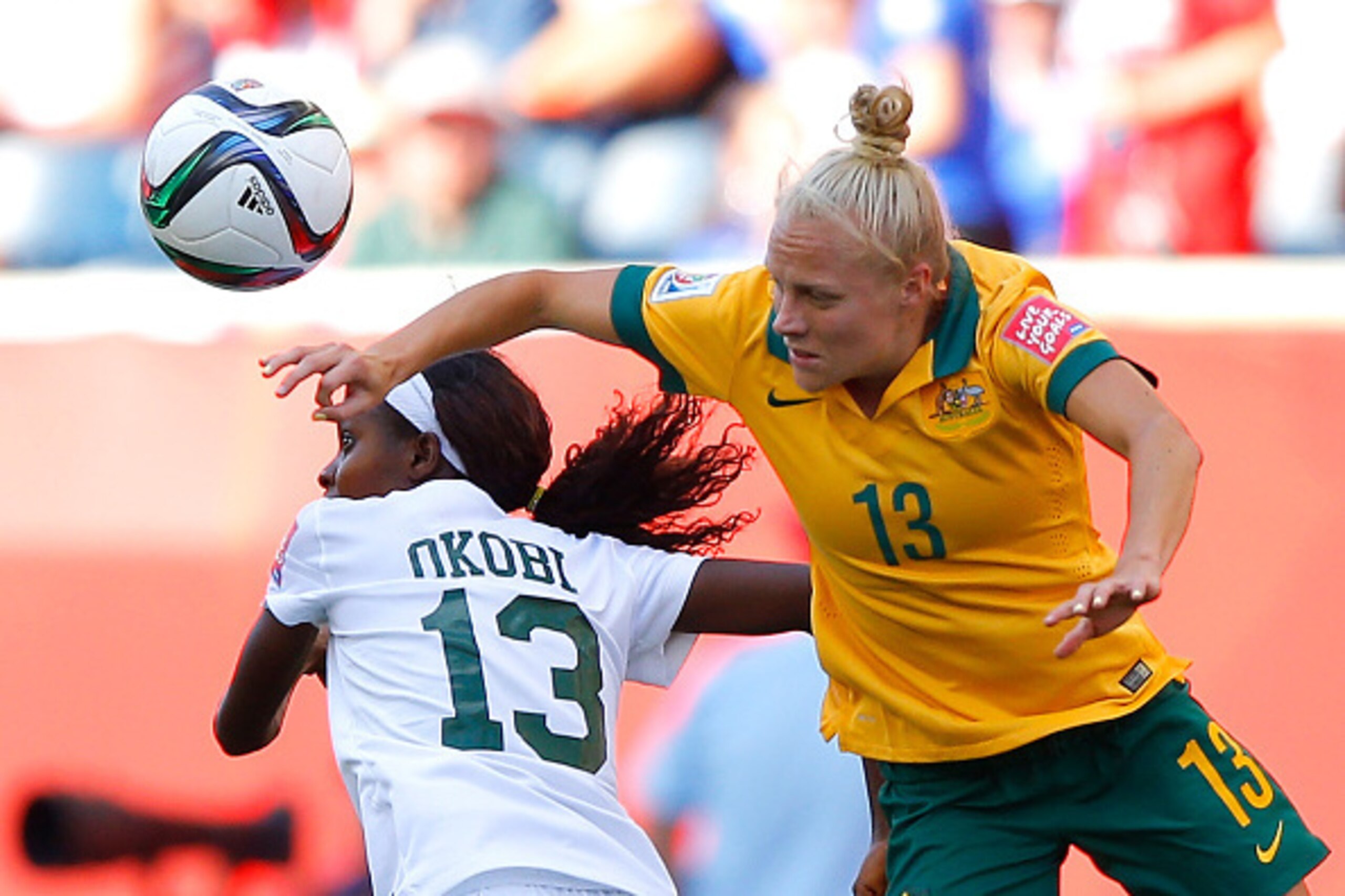 WINNIPEG, MB - JUNE 12:  Tameka Butt #13 of Australia battles for a header against Ngozi Okobi #13 of Nigeria during the FIFA Women's World Cup Canada 2015 match between Australia and Nigeria at Winnipeg Stadium on June 12, 2015 in Winnipeg, Canada.  (Pho
