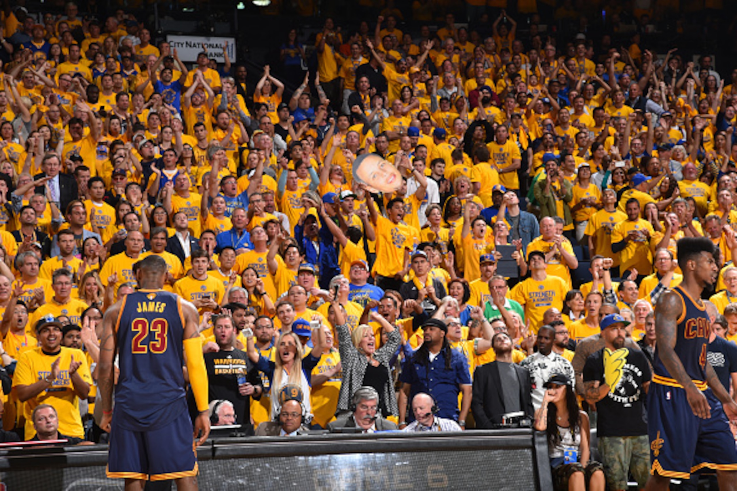 OAKLAND,CA - JUNE 14:  Fans of the Golden State Warriors get pumped up against the Cleveland Cavaliers at the Oracle Arena During Game Five of the 2015 NBA Finals on June 14, 2015 in Oakland, California NOTE TO USER: User expressly acknowledges and agrees