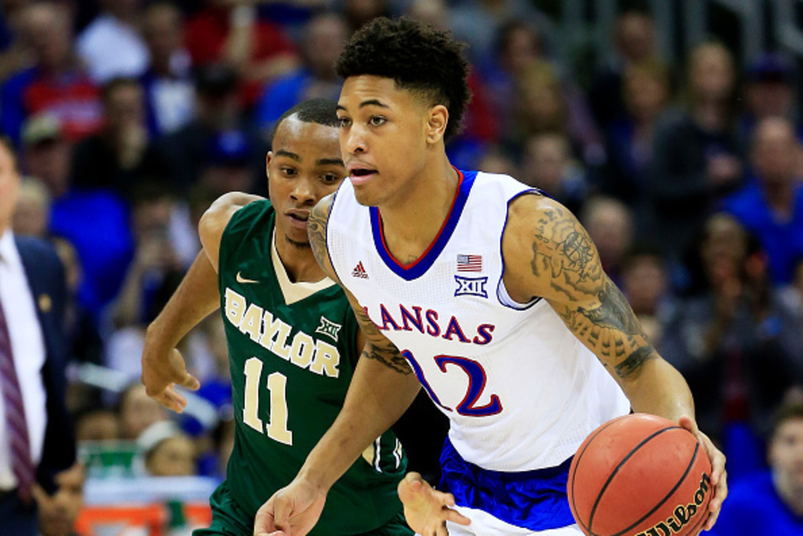 KANSAS CITY, MO - MARCH 13:  Kelly Oubre Jr. #12 of the Kansas Jayhawks drives against Lester Medford #11 of the Baylor Bears in the first half during a semifinal game of the 2015 Big 12 Basketball Tournament at Sprint Center on March 13, 2015 in Kansas C