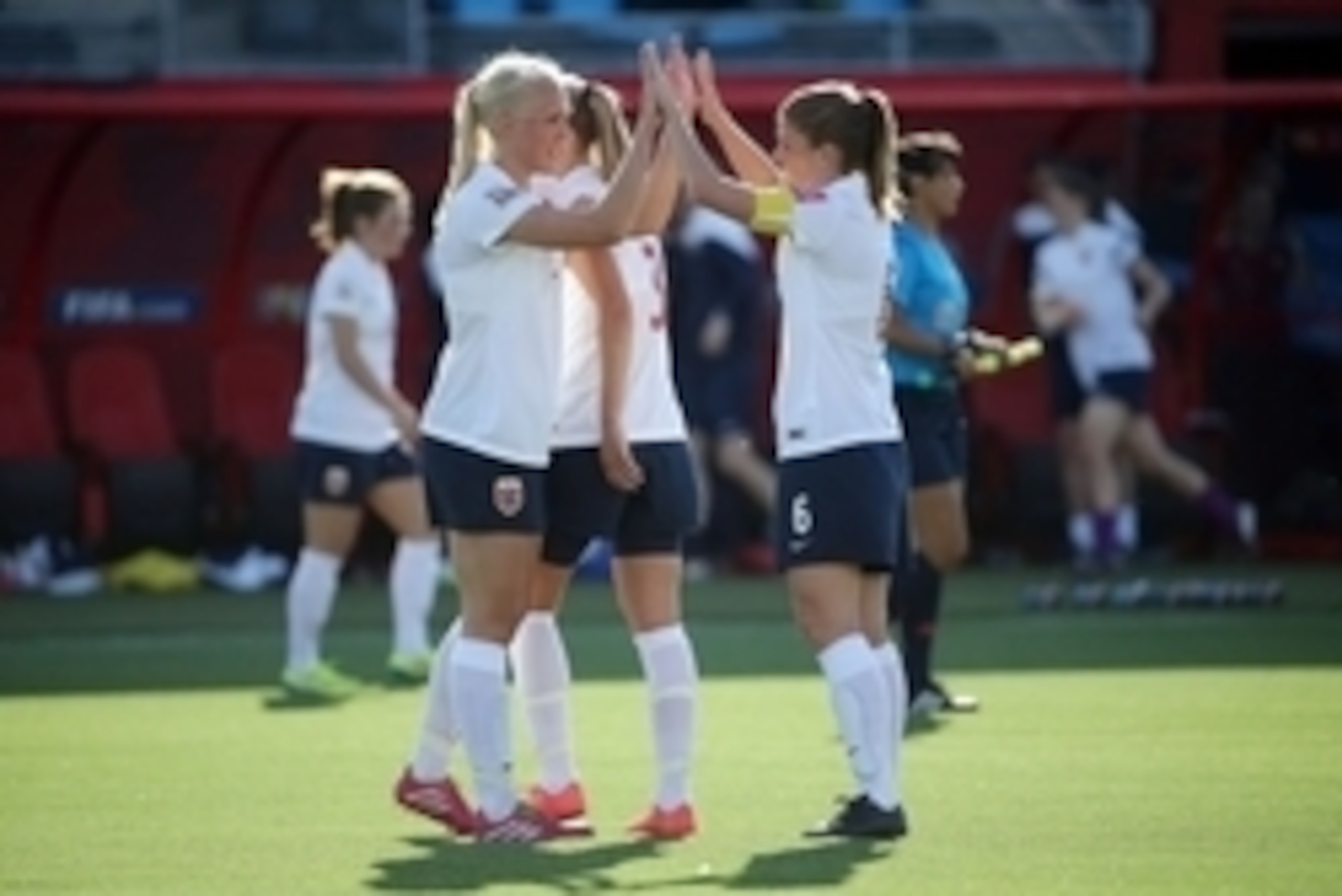 Jun 15, 2015; Moncton, New Brunswick, CAN; Norway defender Maria Thorisdottir (2) high fives Norway midfielder Maren Mjelde (6) after their Group B soccer match against Ivory Coast in the 2015 FIFA women's World Cup at Moncton Stadium. Norway wins 3-1. Ma