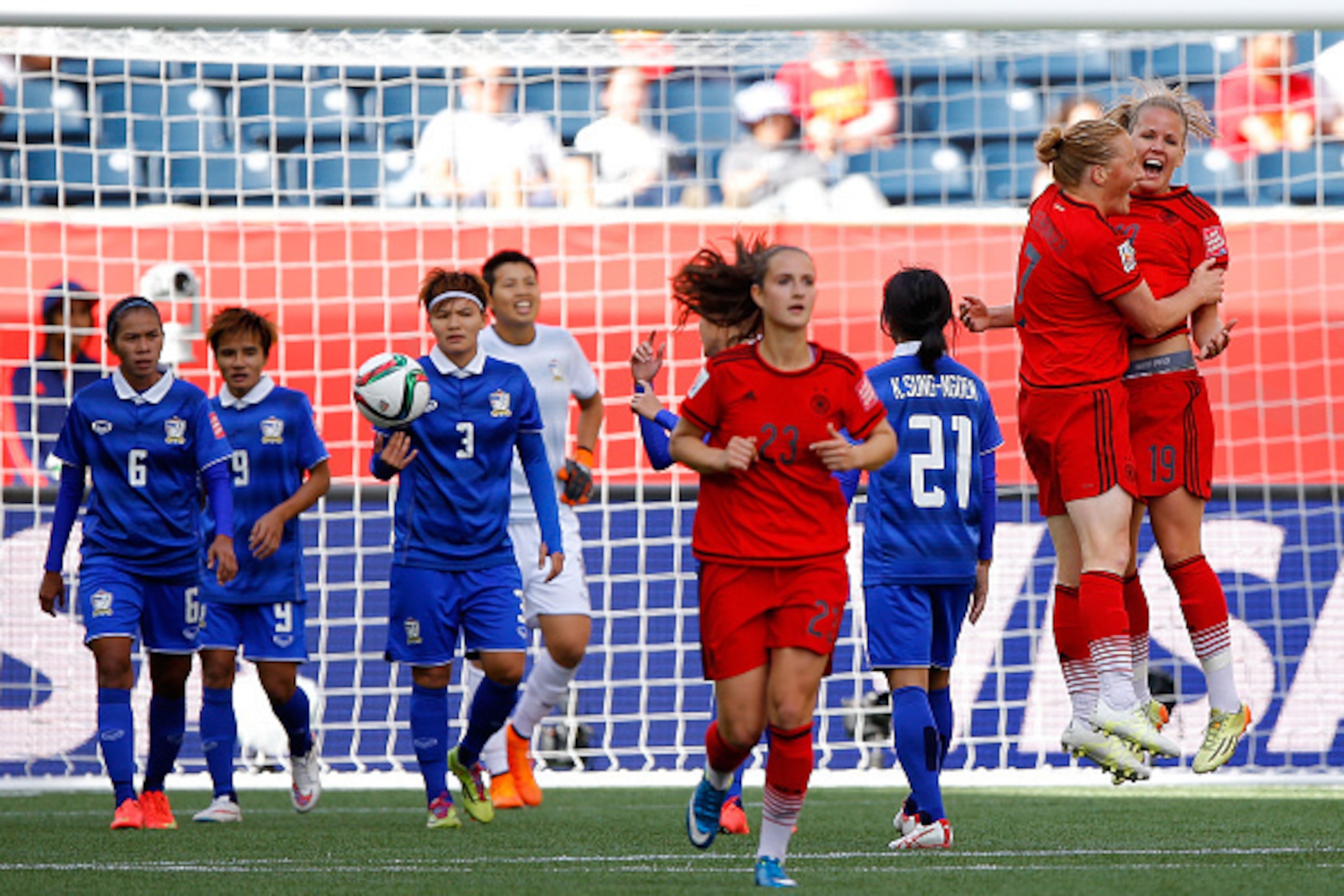 WINNIPEG, MB - JUNE 15:  Lena Petermann #19 of Germany celebrates her second goal against Thailand with Melanie Behringer #7 during the FIFA Women's World Cup Canada 2015 match between Thailand and Germany at Winnipeg Stadium on June 15, 2015 in Winnipeg,