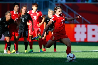 WINNIPEG, MB - JUNE 15:  Wang Lisi #21 of China PR scores their first goal on a penalty kick against New Zealand during the FIFA Women's World Cup Canada 2015 Group A match between China PR and New Zealand at Winnipeg Stadium on June 15, 2015 in Winnipeg,