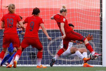 WINNIPEG, MB - JUNE 15:  Goalkeeper Waraporn Boonsing #1 of Thailand saves a shot attempt by Anja Mittag #11 of Germany during the FIFA Women's World Cup Canada 2015 match between Thailand and Germany at Winnipeg Stadium on June 15, 2015 in Winnipeg, Cana