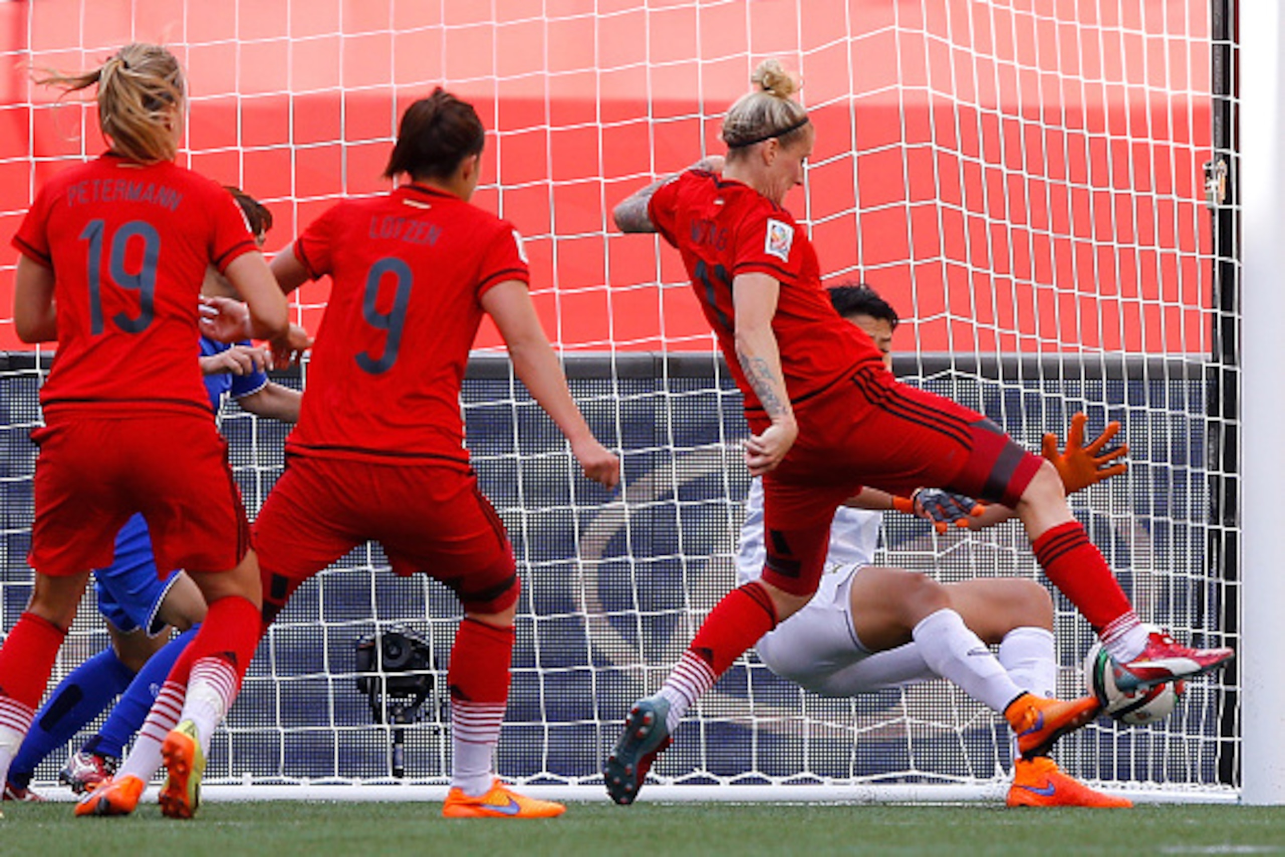 WINNIPEG, MB - JUNE 15:  Goalkeeper Waraporn Boonsing #1 of Thailand saves a shot attempt by Anja Mittag #11 of Germany during the FIFA Women's World Cup Canada 2015 match between Thailand and Germany at Winnipeg Stadium on June 15, 2015 in Winnipeg, Cana