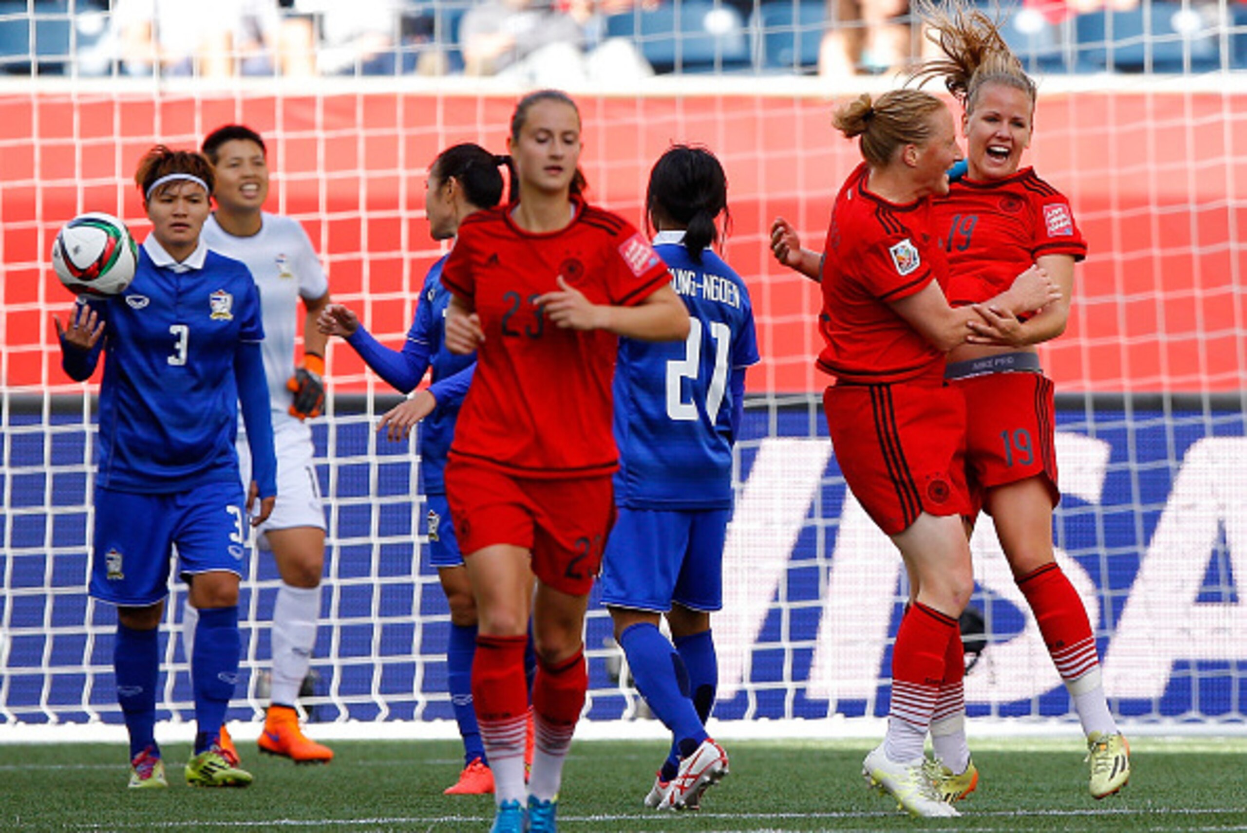 WINNIPEG, MB - JUNE 15:  Lena Petermann #19 of Germany celebrates her second goal against Thailand with Melanie Behringer #7 during the FIFA Women's World Cup Canada 2015 match between Thailand and Germany at Winnipeg Stadium on June 15, 2015 in Winnipeg,