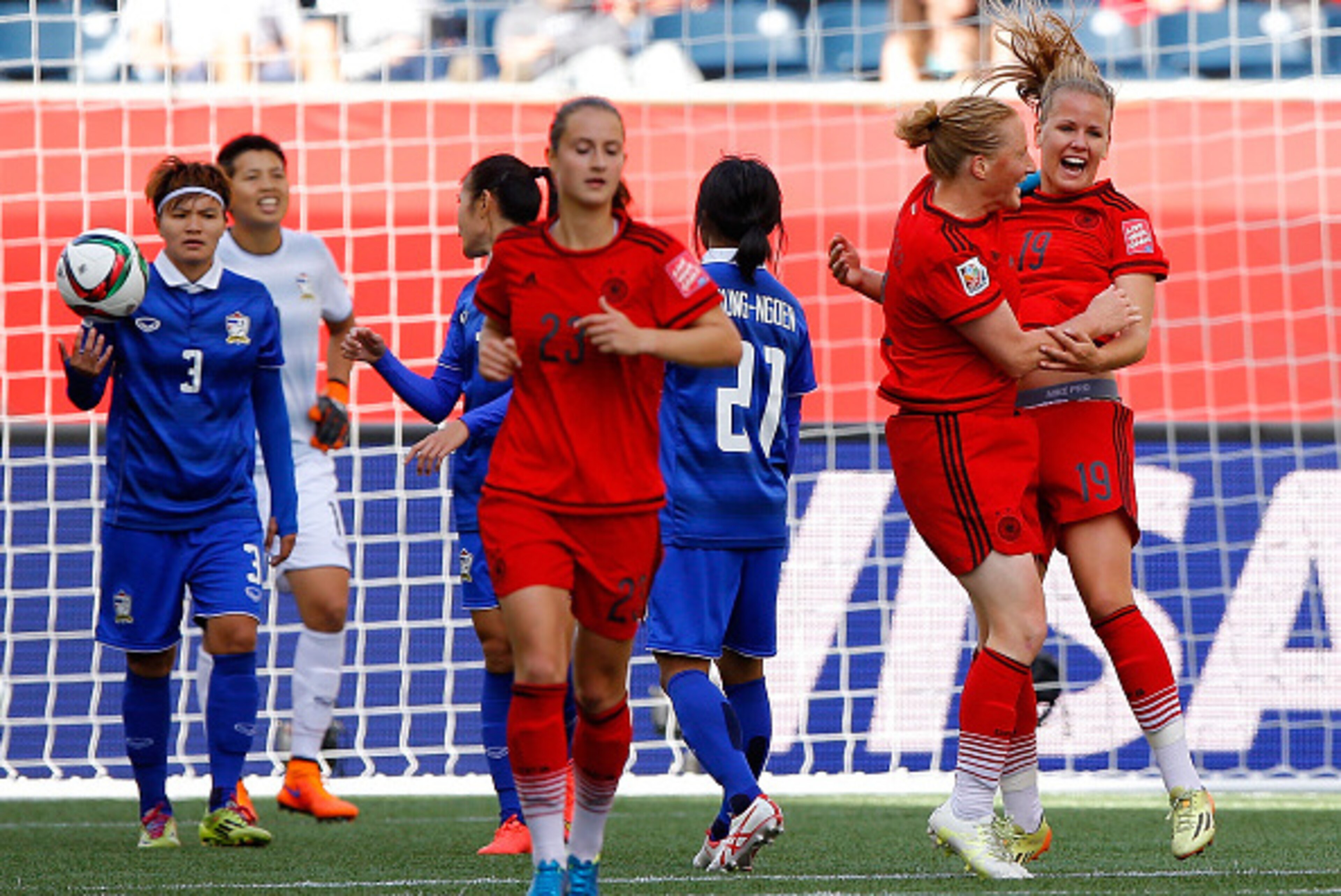 WINNIPEG, MB - JUNE 15:  Lena Petermann #19 of Germany celebrates her second goal against Thailand with Melanie Behringer #7 during the FIFA Women's World Cup Canada 2015 match between Thailand and Germany at Winnipeg Stadium on June 15, 2015 in Winnipeg,