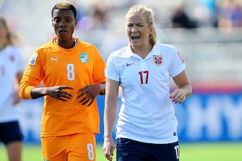 MONCTON, NB - JUNE 15:  Lene Mykjaland #17 of Norway reacts as Ines Nrehy #8 of Ivory Coast looks on in the first half during the FIFA Women's World Cup 2015 Group B match at Moncton Stadium on June 15, 2015 in Moncton, Canada.  (Photo by Elsa/Getty Image