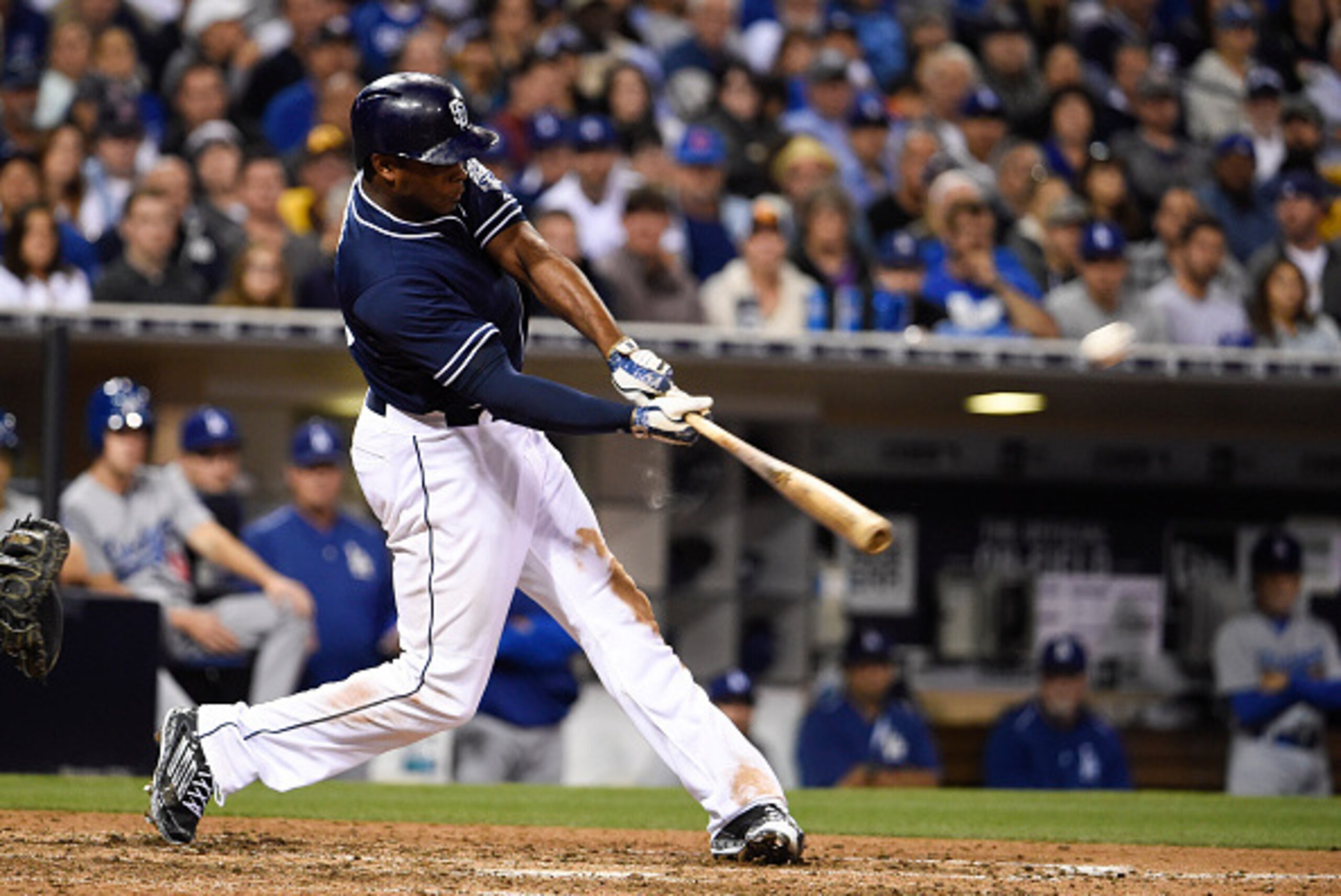 SAN DIEGO, CA - JUNE 13:  Justin Upton #10 of the San Diego Padres hits a solo home run during the eighth inning of a baseball game against the Los Angeles Dodgers at Petco Park June 13, 2015 in San Diego, California.  (Photo by Denis Poroy/Getty Images)