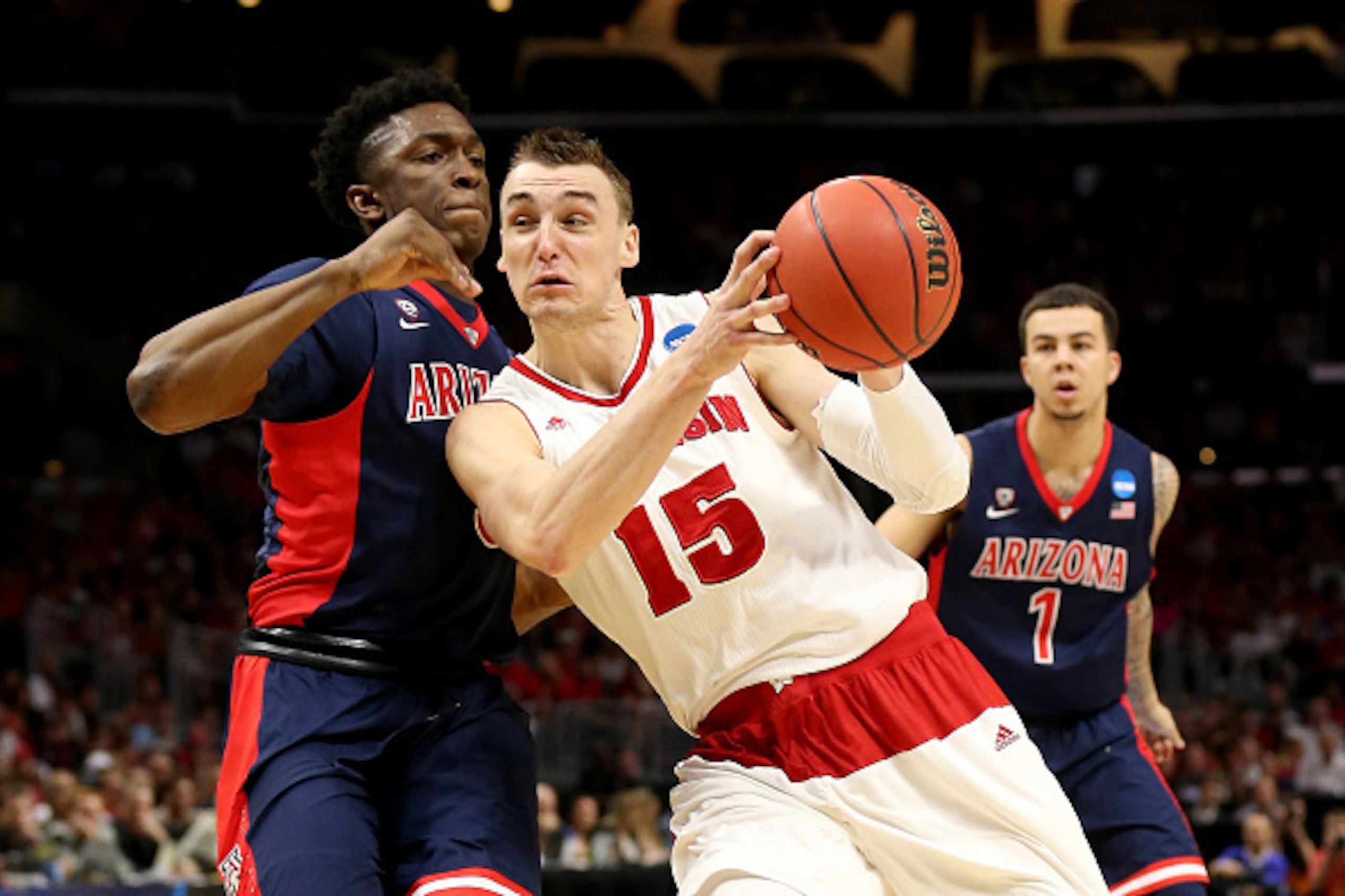 LOS ANGELES, CA - MARCH 28:  Sam Dekker #15 of the Wisconsin Badgers goes up for a shot against Stanley Johnson #5 of the Arizona Wildcats in the first half during the West Regional Final of the 2015 NCAA Men's Basketball Tournament at Staples Center on M