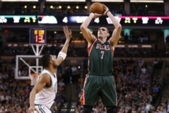 Apr 3, 2015; Boston, MA, USA; Milwaukee Bucks forward Ersan Ilyasova (7) shoots against Boston Celtics guard Evan Turner (11) in the second half at TD Garden. The Bucks defeated the Celtics 110 to 101. Mandatory Credit: David Butler II-USA TODAY Sports