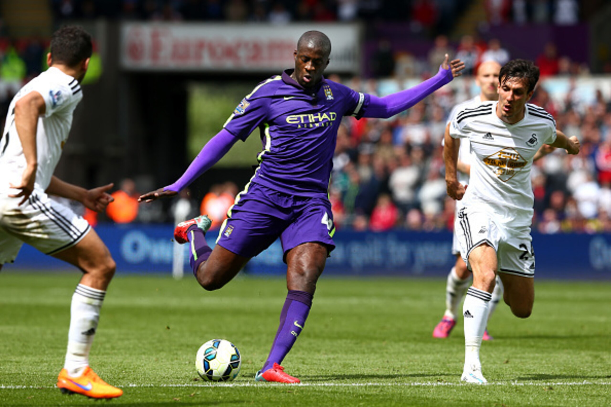 SWANSEA, WALES - MAY 17:  Yaya Toure of Manchester City scores his team's third goal during the Barclays Premier League match between Swansea and Manchester City at the Liberty Stadium on May 17, 2015 in Swansea, Wales.  (Photo by Michael Steele/Getty Ima