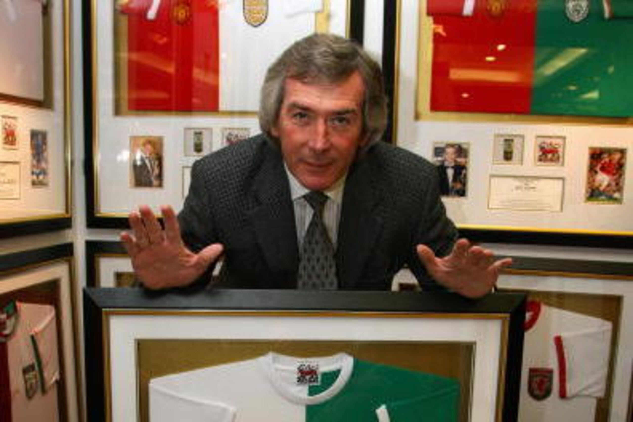 LONDON - NOVEMBER 12:  Former professional footballer Pat Jennings poses in front of his framed, signed shirt that will be auctioned for charity in Harrods on November 12, 2007 in London, England. The shirt is one of 34 signed by winners of the PFA Player