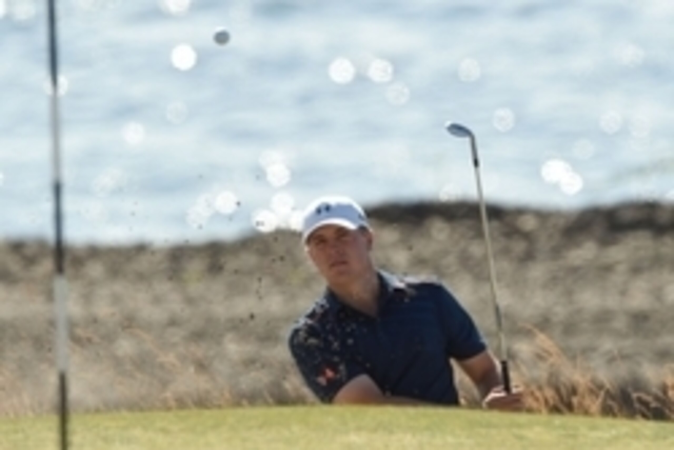 Jun 15, 2015; University Place, WA, USA; Jordan Spieth hits out of the bunker on the 16th hole during practice rounds on Monday at Chambers Bay. Mandatory Credit: John David Mercer-USA TODAY Sports
