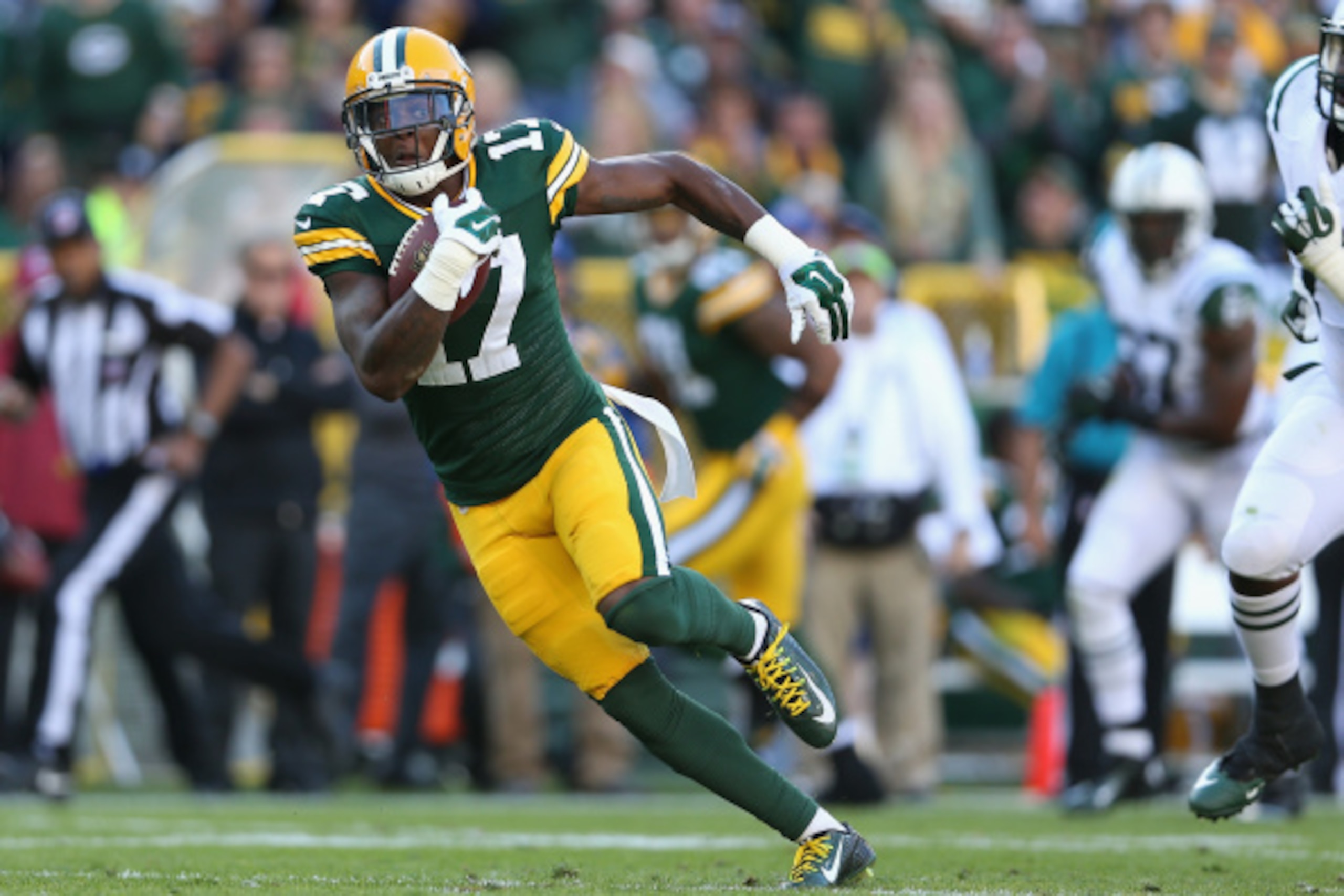 GREEN BAY, WI - SEPTEMBER 14:  Wide receiver Davante Adams #17 of the Green Bay Packers runs with the football after a reception against the New York Jets during the NFL game at Lambeau Field on September 14, 2014 in Green Bay, Wisconsin.  The Packers def