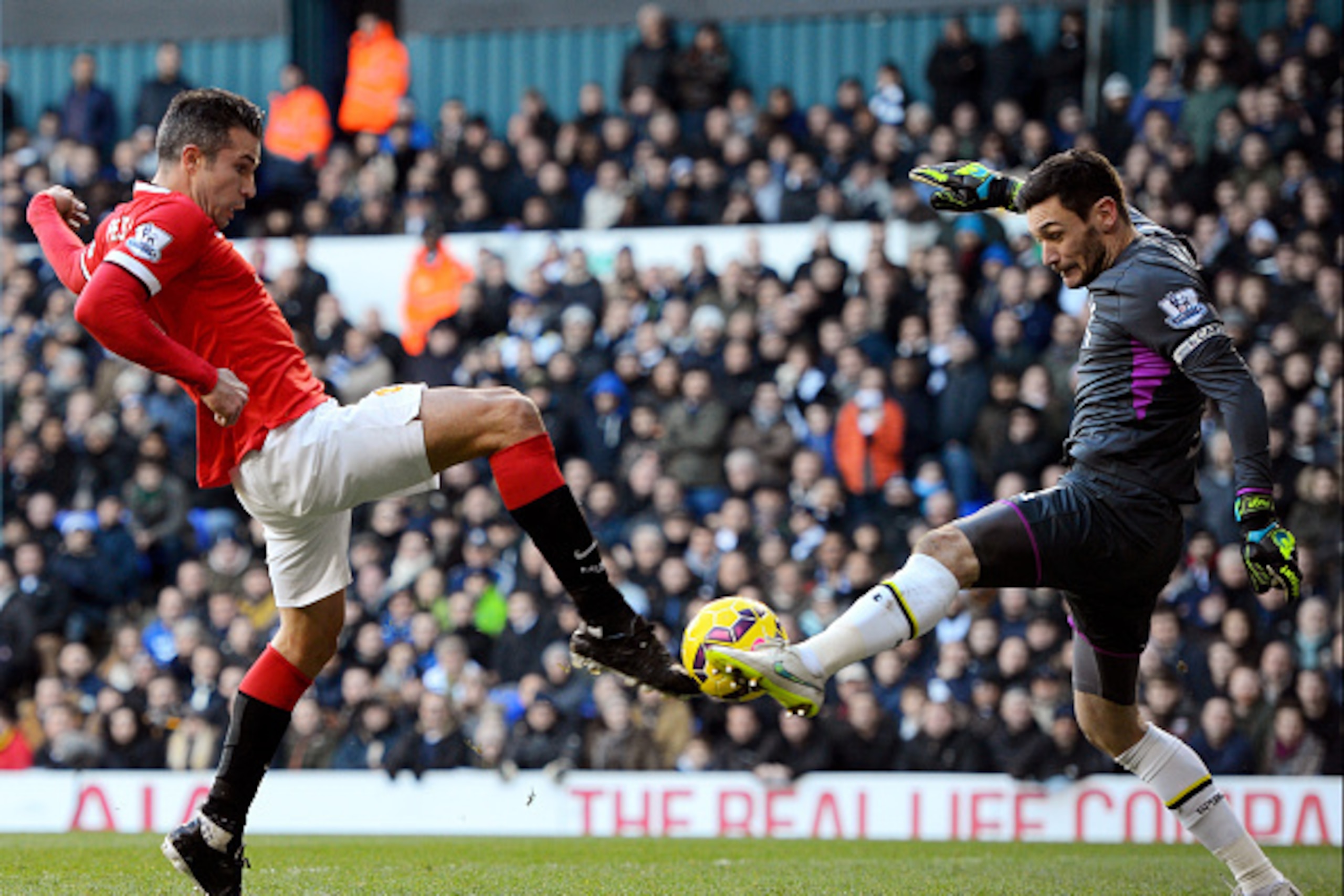 LONDON, ENGLAND - DECEMBER 28:  Robin van Persie of Manchester United has his attempt on goal saved by goalkeeper Hugo Lloris of Spurs during the Barclays Premier League match between Tottenham Hotspur and Manchester United at White Hart Lane on December 
