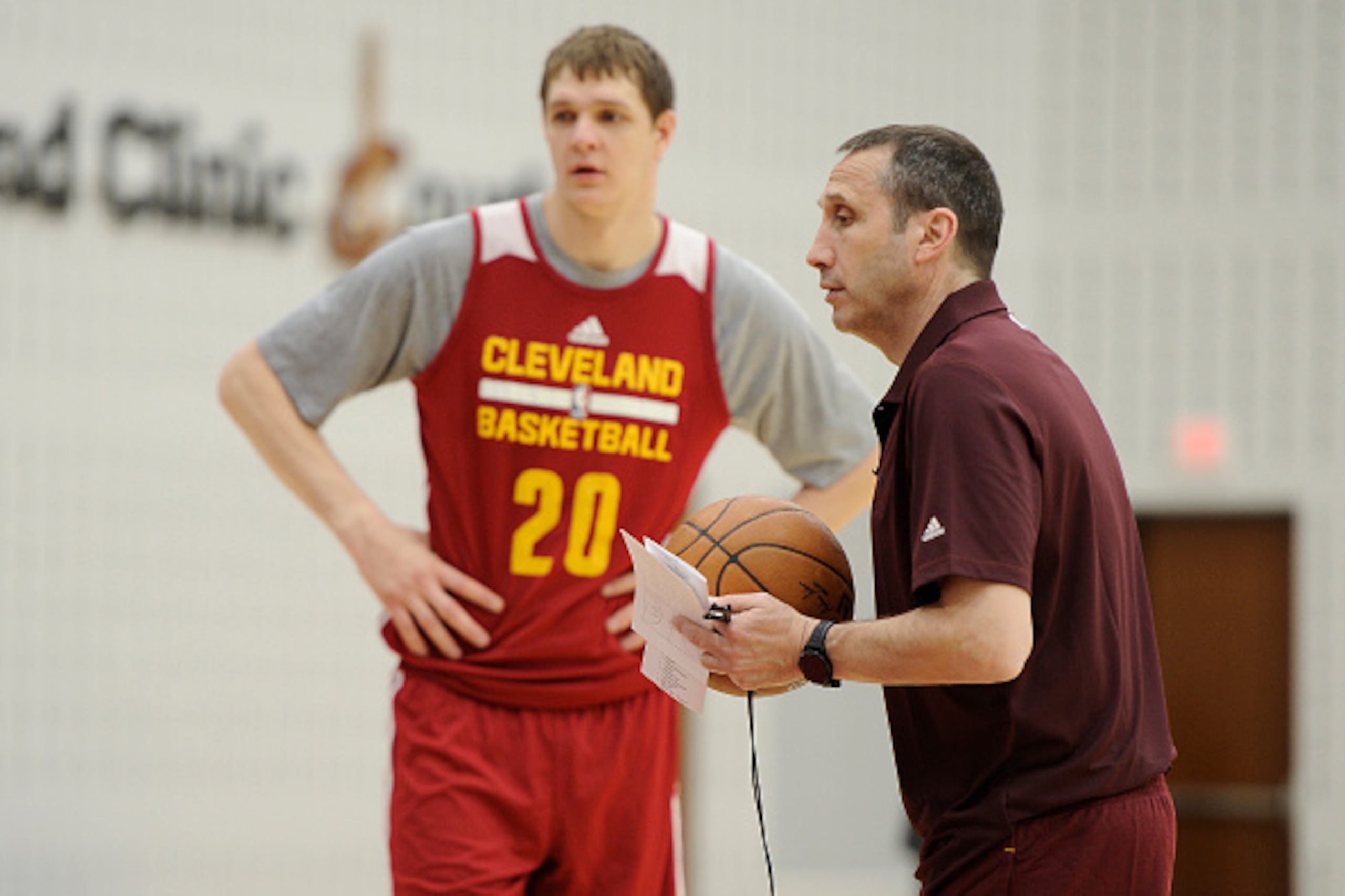 CLEVELAND, OH - MARCH 19:  Timofey Mozgov #20 and David Blatt of the Cleveland Cavaliers practice during an all-access event on March 19, 2015 in Cleveland, Ohio. NOTE TO USER: User expressly acknowledges and agrees that, by downloading and/or using this