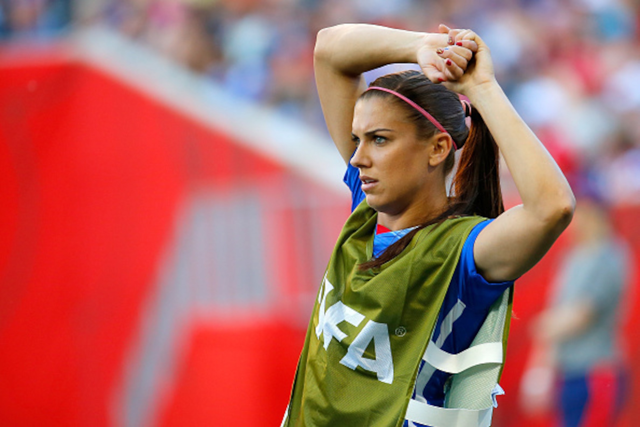 WINNIPEG, MB - JUNE 12:  Alex Morgan #13 of the United States stretches in the second half while taking on Sweden in the FIFA Women's World Cup Canada 2015 match at Winnipeg Stadium on June 12, 2015 in Winnipeg, Canada.  (Photo by Kevin C. Cox/Getty Image