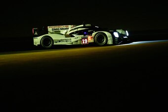LE MANS, FRANCE - JUNE 13:  The Porsche Team 919 Hybrid of Earl Bamber, Nick Tandy and Nico Hulkenburg drives during the Le Mans 24 Hour race at the Circuit de la Sarthe on June 13, 2015 in Le Mans, France.  (Photo by Ker Robertson/Getty Images)