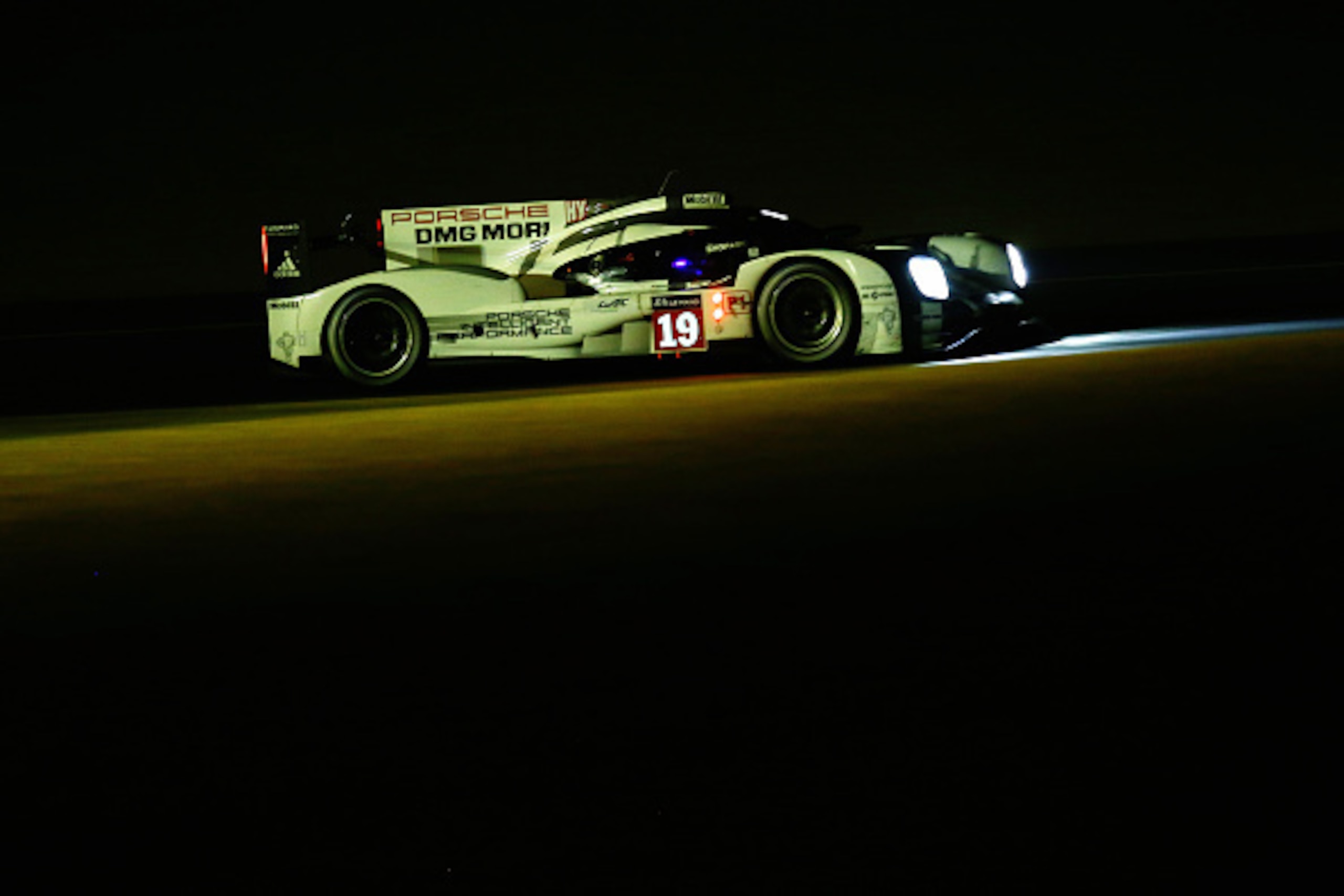 LE MANS, FRANCE - JUNE 13:  The Porsche Team 919 Hybrid of Earl Bamber, Nick Tandy and Nico Hulkenburg drives during the Le Mans 24 Hour race at the Circuit de la Sarthe on June 13, 2015 in Le Mans, France.  (Photo by Ker Robertson/Getty Images)