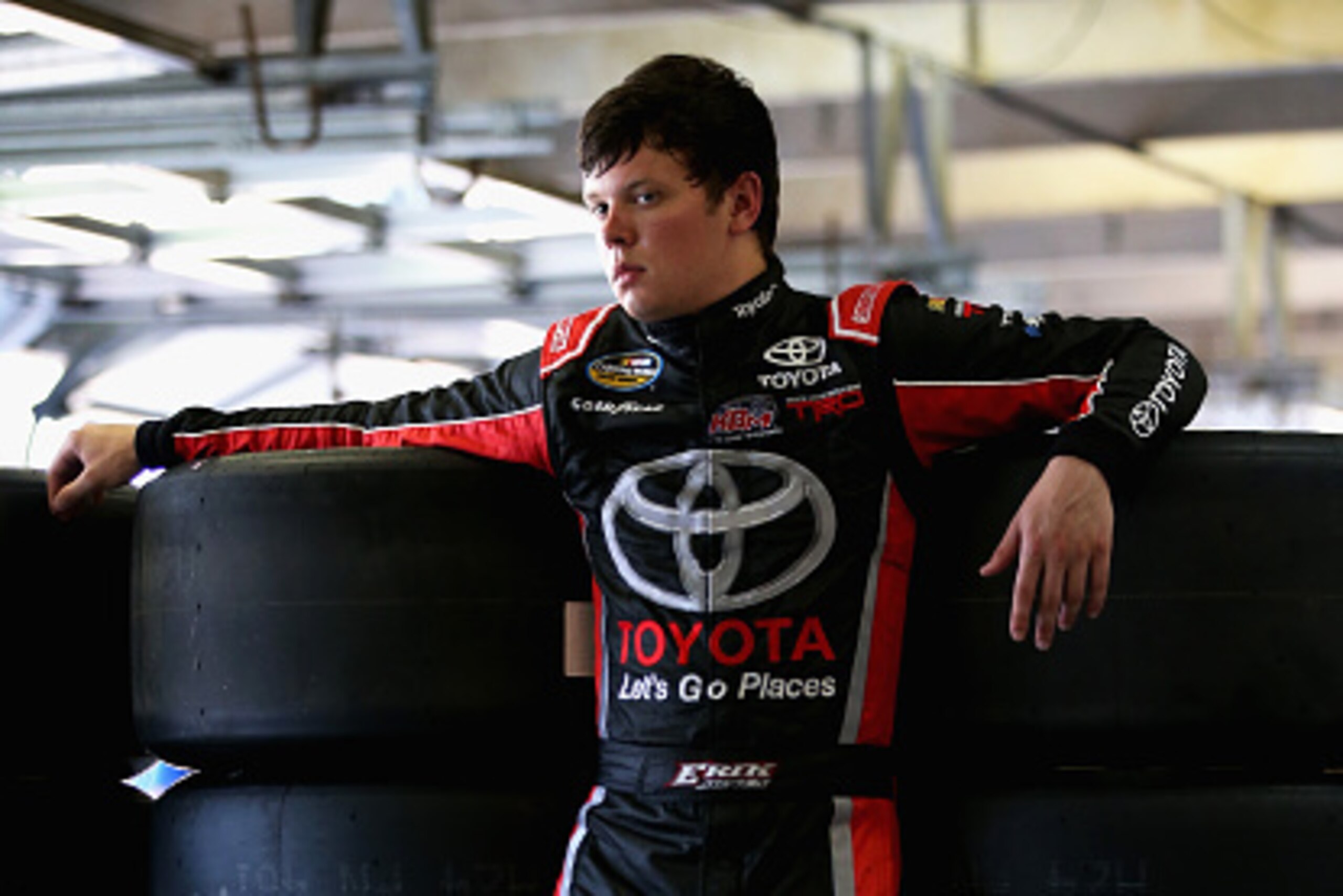FORT WORTH, TX - JUNE 04:  Erik Jones, driver of the #4 Special Olympics World Games Toyota, stands in the garage area during practice for the NASCAR Camping World Truck Series WinStar World Casino & Resort 400 at Texas Motor Speedway on June 4, 2015 in F