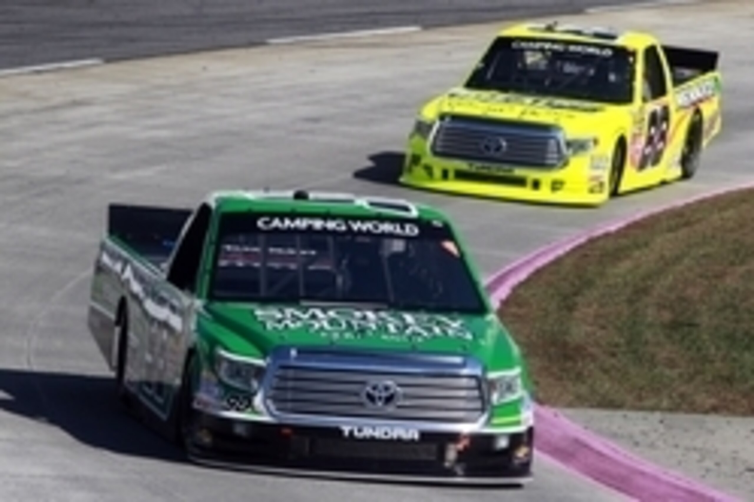Oct 25, 2014; Martinsville, VA, USA; Camping World Truck Series drivers Johnny Sauter (98) and Matt Crafton (88) during the Kroger 200 at Martinsville Speedway. Mandatory Credit: Peter Casey-USA TODAY Sports