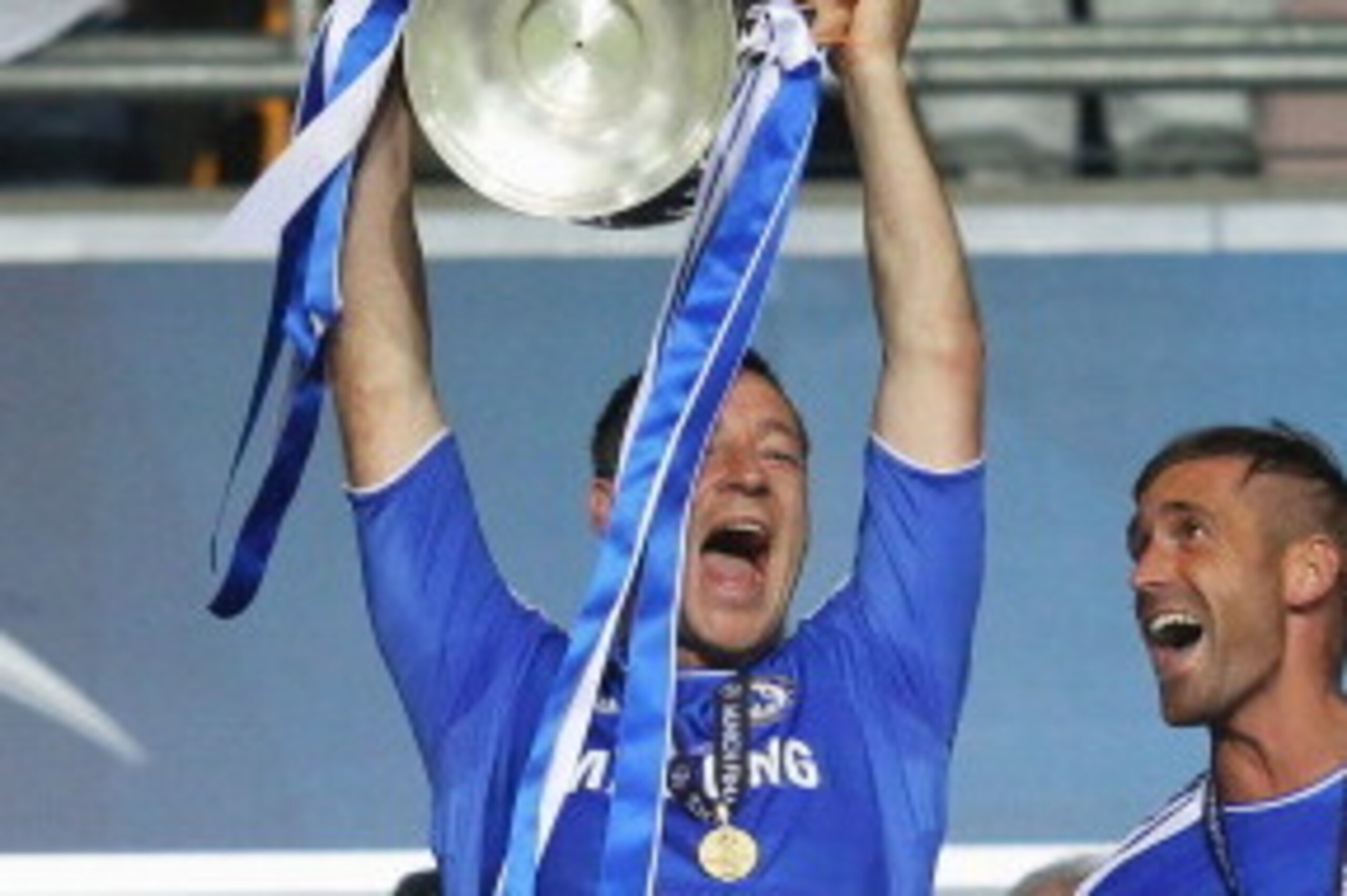 MUNICH, GERMANY - MAY 19:  John Terry of Chelsea lifts the trophy after their victory in the UEFA Champions League Final between FC Bayern Muenchen and Chelsea at the Fussball Arena München on May 19, 2012 in Munich, Germany.  (Photo by Alex Livesey/Getty