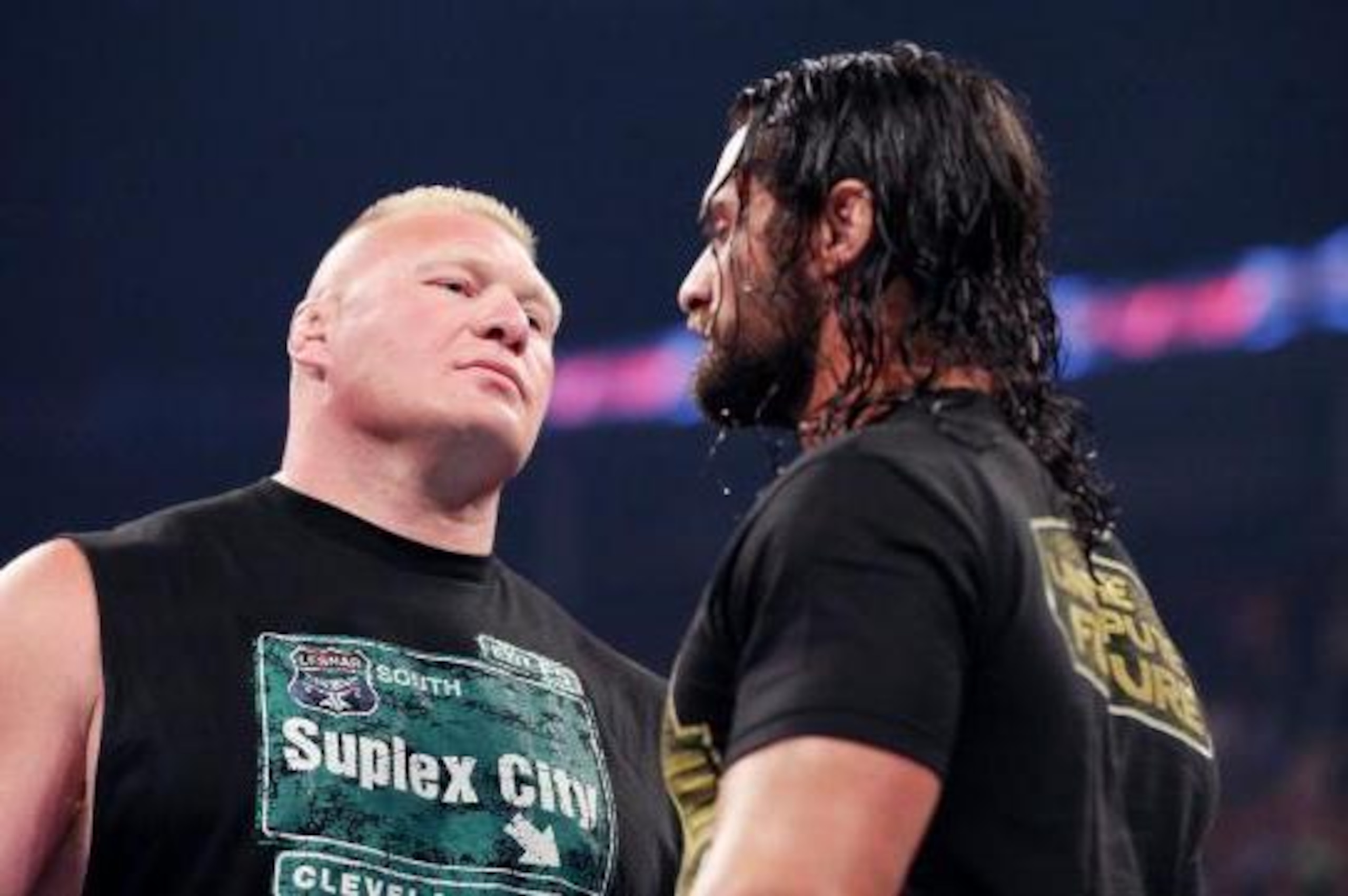 Brock Lesnar stares down Seth Rollins.