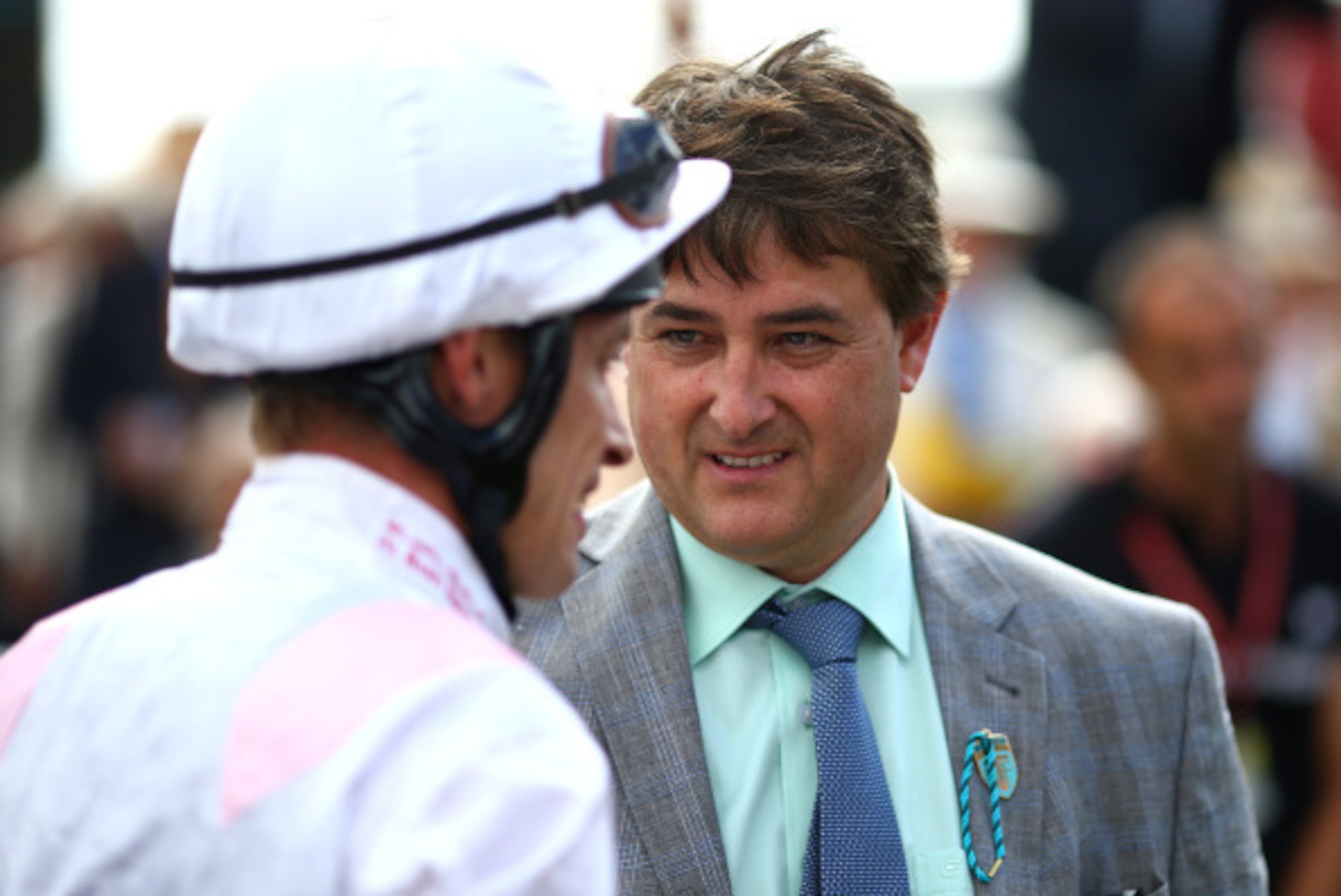 CHICHESTER, ENGLAND - AUGUST 02: Richard Hughes chats with trainer Robert Cowell (R) after riding Intrinsic to win The 32Red Cup at Goodwood racecourse on August 02, 2014 in Chichester, England. (Photo by Charlie Crowhurst/Getty Images)