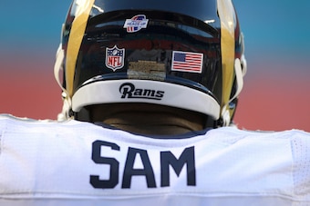 MIAMI GARDENS, FL - AUGUST 28:  Defensive end Michael Sam #96 of the St. Louis Rams takes part in  pregame workouts before his team met the Miami Dolphins at Sun Life Stadium on August 28, 2014 in Miami Gardens, Florida.  (Photo by Marc Serota/Getty Image