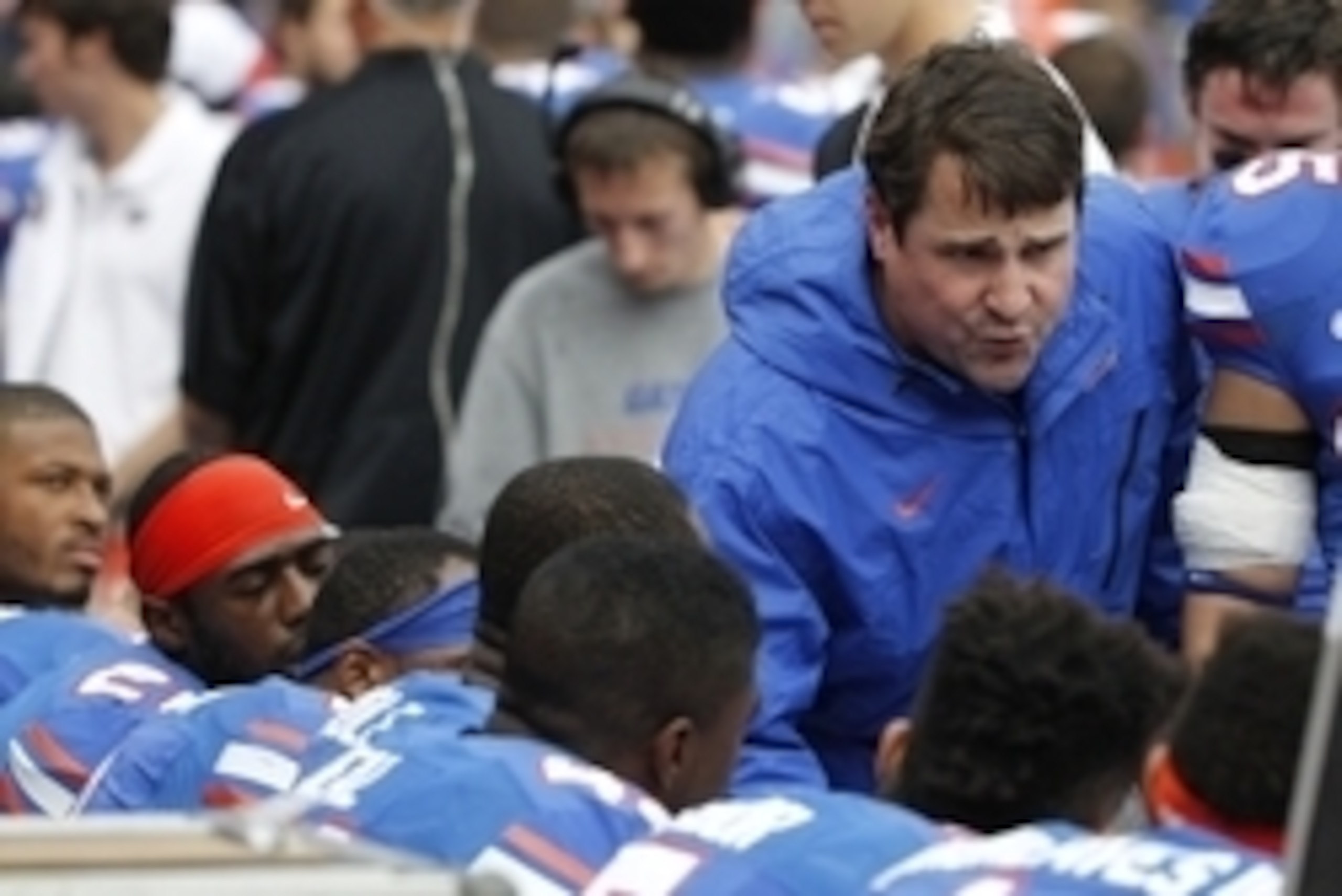 Nov 22, 2014; Gainesville, FL, USA; Florida Gators head coach Will Muschamp talks with the defense on the bench against the Eastern Kentucky Colonels during the first quarter at Ben Hill Griffin Stadium. Mandatory Credit: Kim Klement-USA TODAY Sports
