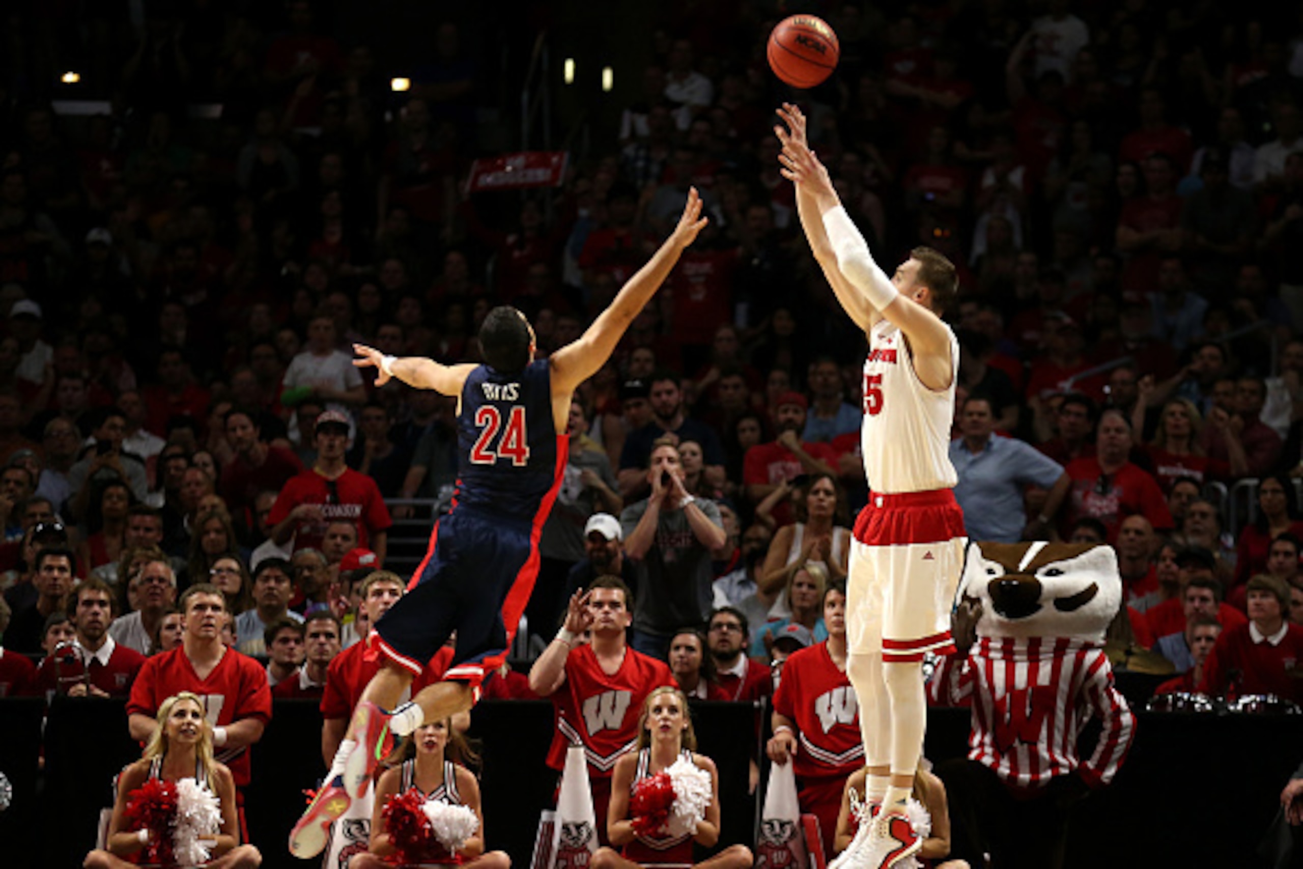 LOS ANGELES, CA - MARCH 28:  Sam Dekker #15 of the Wisconsin Badgers makes a three-pointer over Elliott Pitts #24 of the Arizona Wildcats in the second half during the West Regional Final of the 2015 NCAA Men's Basketball Tournament at Staples Center on M