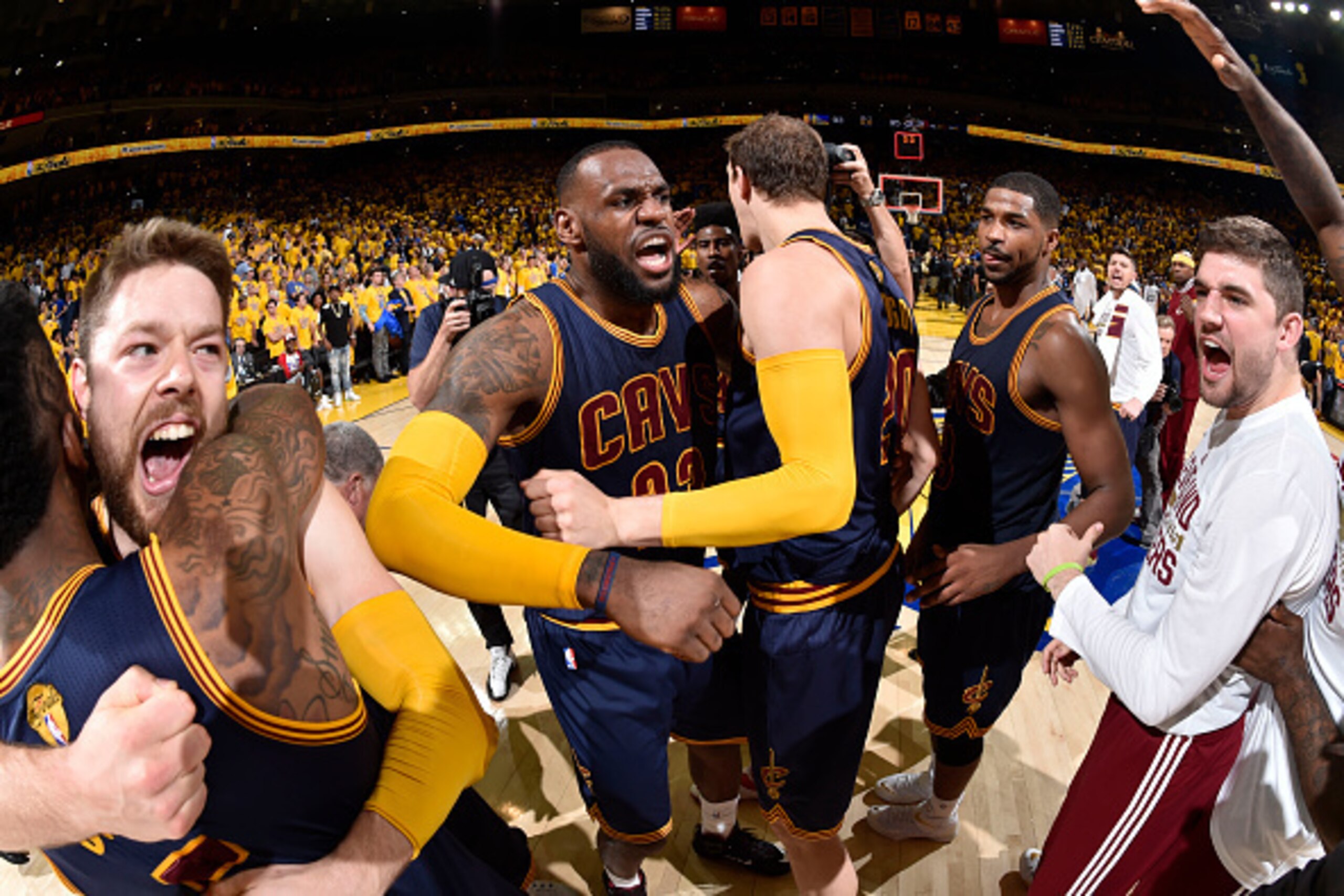 OAKLAND, CA - JUNE 7:  Matthew Dellavedova #8, LeBron James #23, Timofey Mozgov #20, and Tristan Thompson #13 of the Cleveland Cavaliers celebrate after an overtime victory over the Golden State Warriors in Game Two of the 2015 NBA Finals on June 7, 2015 
