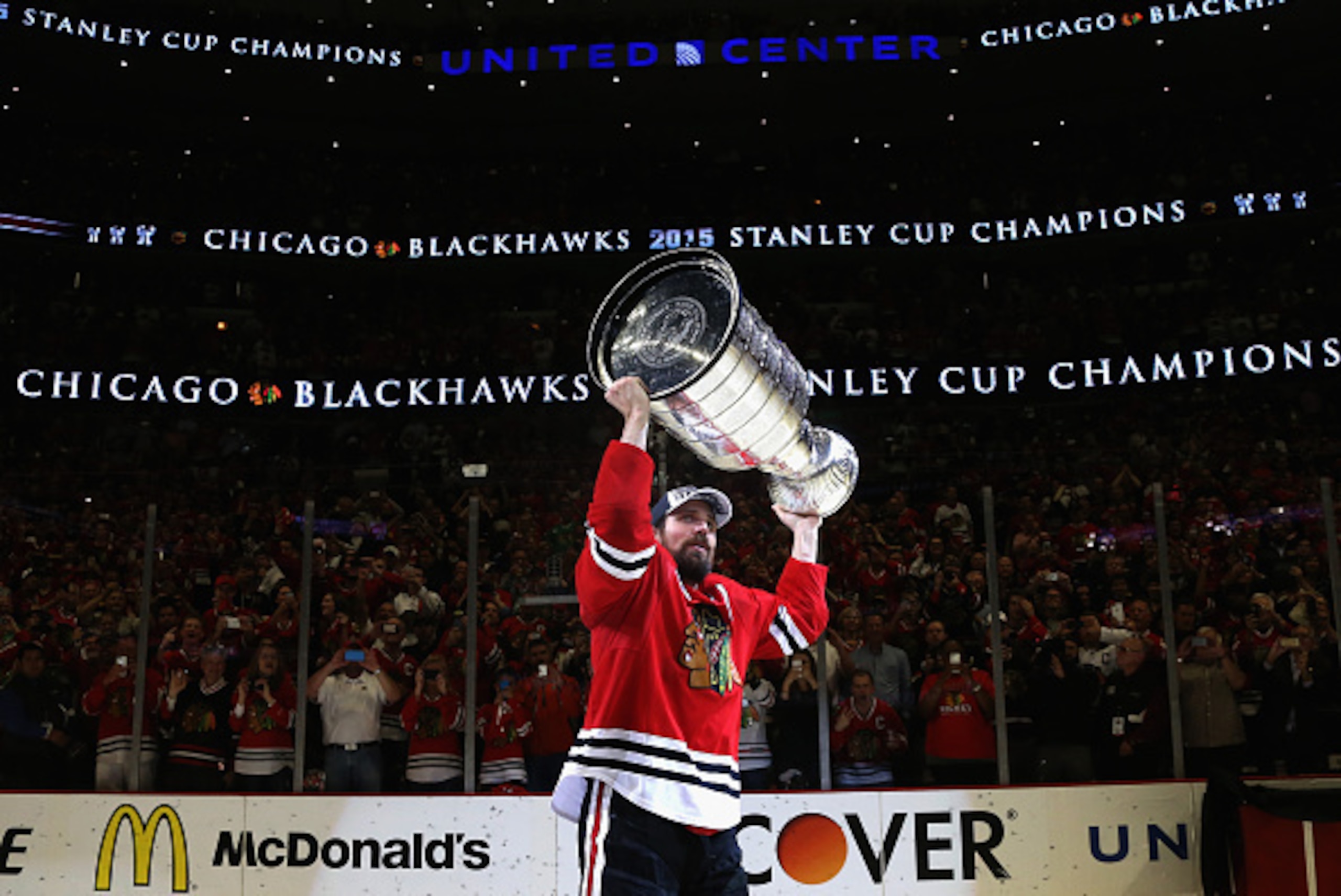 CHICAGO, IL - JUNE 15:  Patrick Sharp #10 of the Chicago Blackhawks hoists the Stanley Cup in celebration after his team defeated the Tampa Bay Lightning 2-0 in Game Six of the 2015 NHL Stanley Cup Final at the United Center on June 15, 2015 in Chicago, I