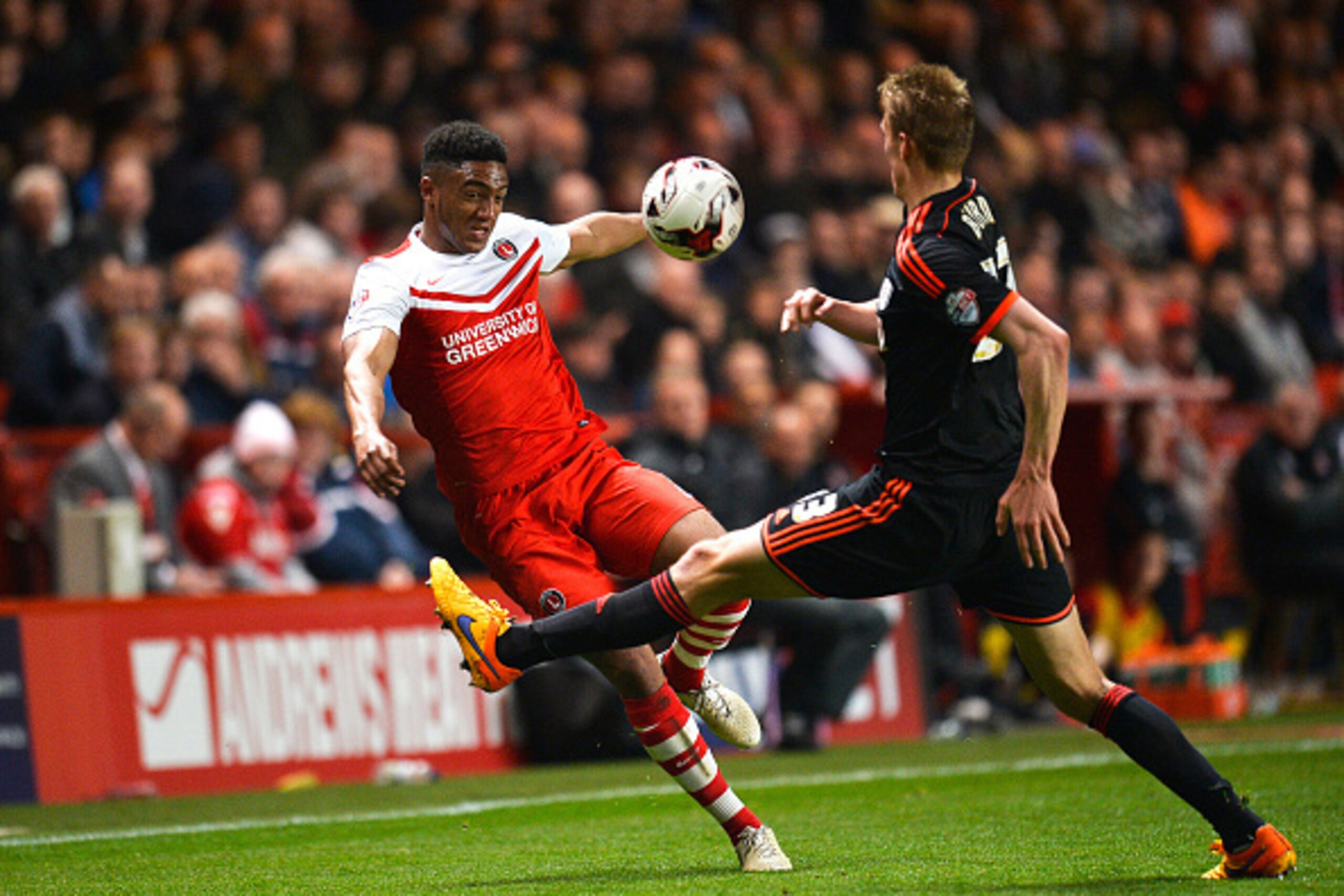 LONDON, ENGLAND - APRIL 07:  Joseph Gomez of Charlton and Dan Burn of Fulham during the Sky Bet Championship match between Charlton Athletic and Fulham at The Valley on April 7, 2015 in London, England.  (Photo by Justin Setterfield/Getty Images)