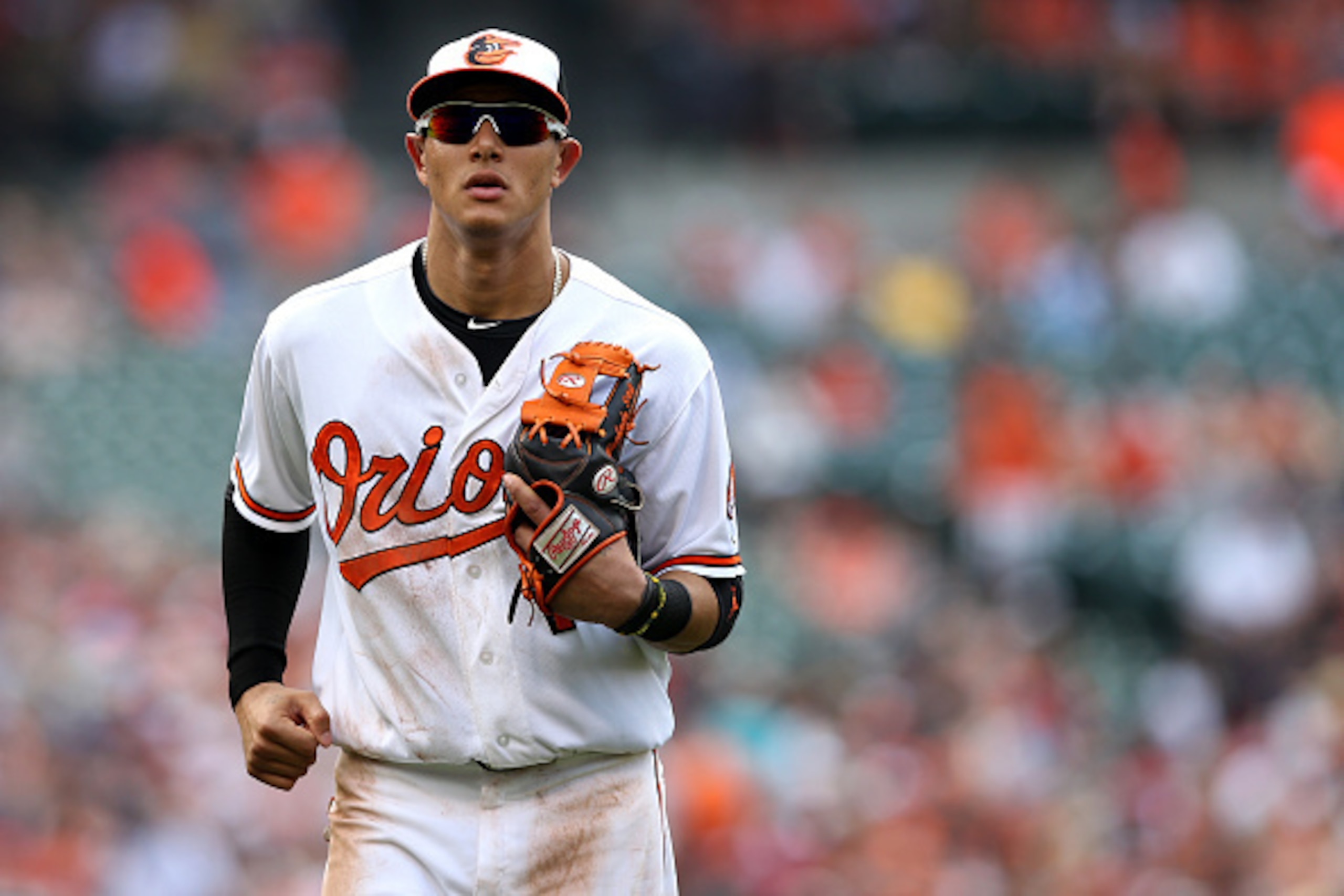 BALTIMORE, MD - JUNE 14: Manny Machado #13 of the Baltimore Orioles runs off the field against the New York Yankees at Oriole Park at Camden Yards on June 14, 2015 in Baltimore, Maryland. The New York Yankees won, 5-3. (Photo by Patrick Smith/Getty Images