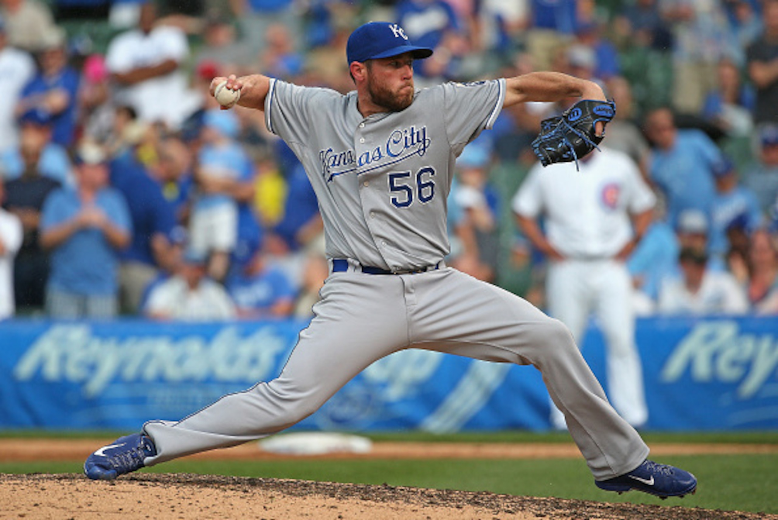 CHICAGO, IL - MAY 29: Greg Holland #56 of the Kansas City Royals pitches in the 9th inning against the Chicago Cubs at Wrigley Field on May 29, 2015 in Chicago, Illinois. The Royals defeated the Cubs 8-4. (Photo by Jonathan Daniel/Getty Images)